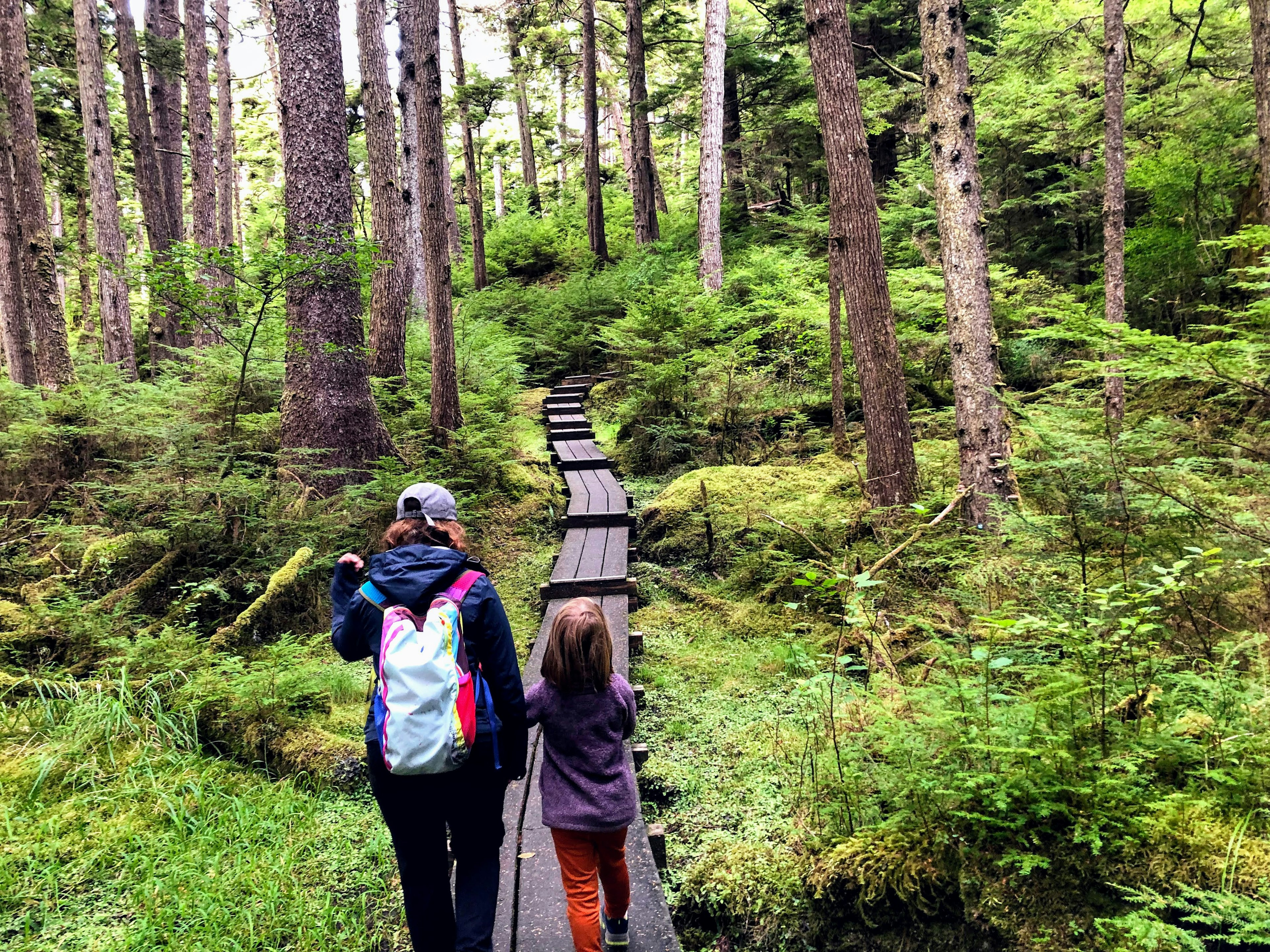 A mother and daughter walking in Naikoon Provincial Park, Haida Gwaii, British Columbia, Canada.
