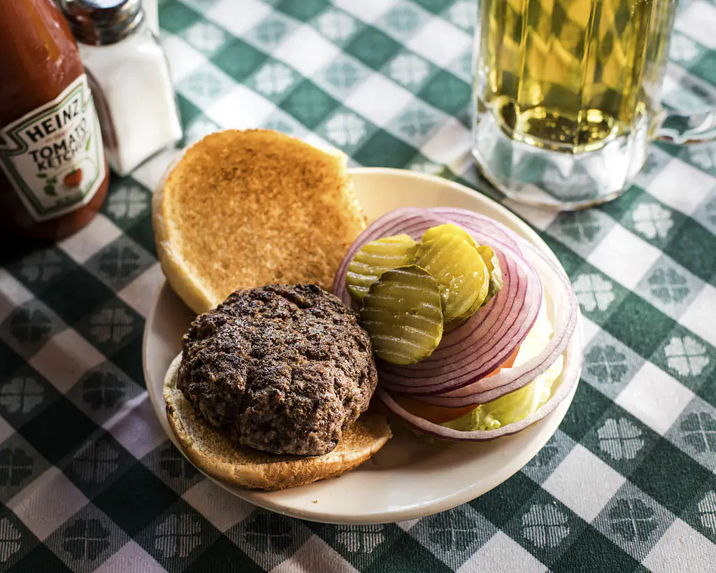 A burger is displayed for a photograph at J.G. Melon restaurant in New York, U.S