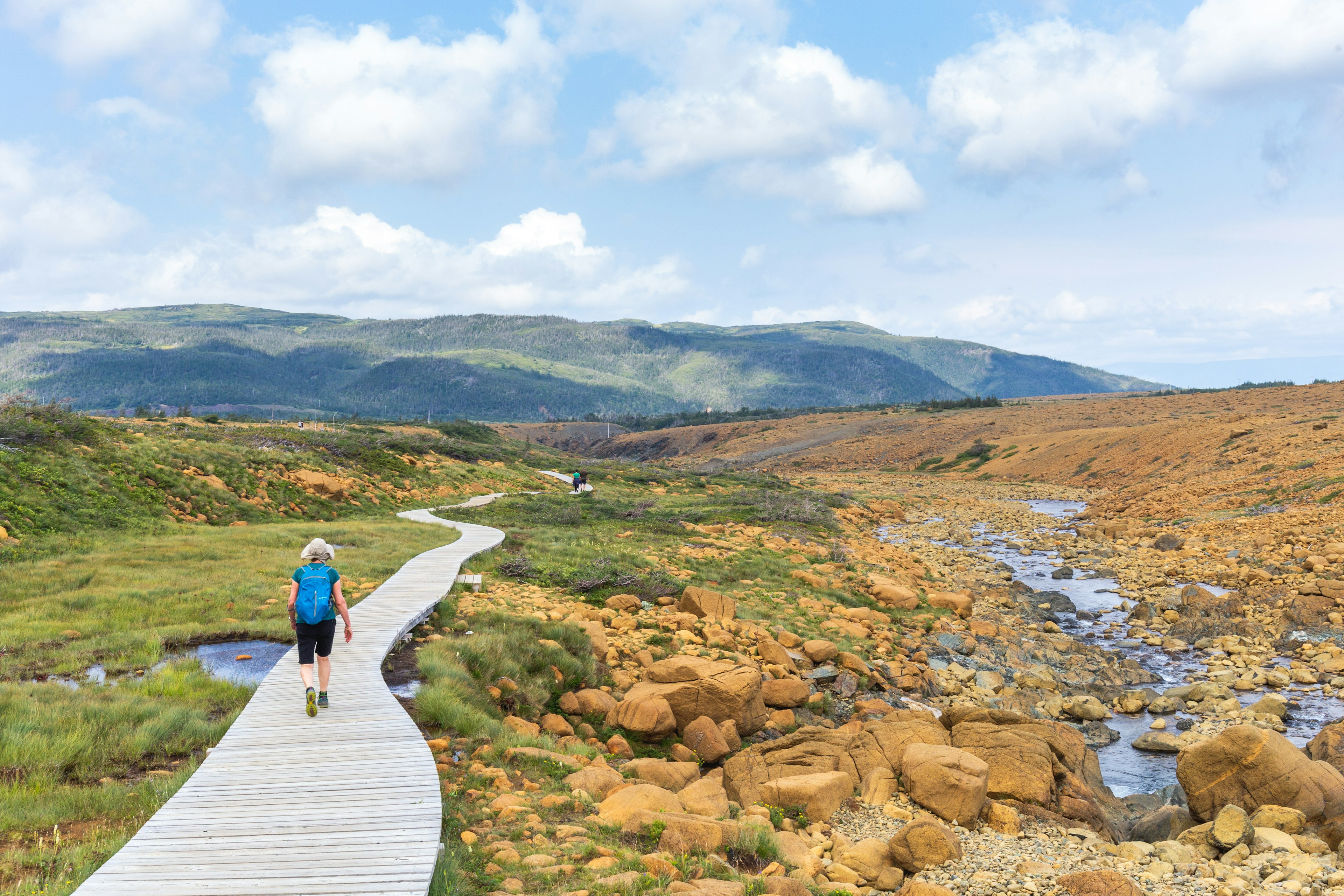 Hikers in the Tablelands, Gros Morne National Park, near Woody Point, Newfoundland, Canada