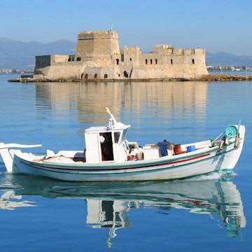 Traditional fishing boat cruising in calm sea of picturesque city of Nafplio and Bourtzi fortress at the background , Argolida, Peloponnese, Greece License Type: media Download Time: 2023-01-28T13:02:51.000Z User: Norma.PrauseBrewer_LonelyPlanet Is Editorial: No purchase_order:
Boat, Building, Castle, Fortress, Person, Vehicle, Water, Watercraft, Waterfront
Traditional fishing boat cruising in calm sea of picturesque city of Nafplio and Bourtzi fortress at the background , Argolida, Peloponnese, Greece