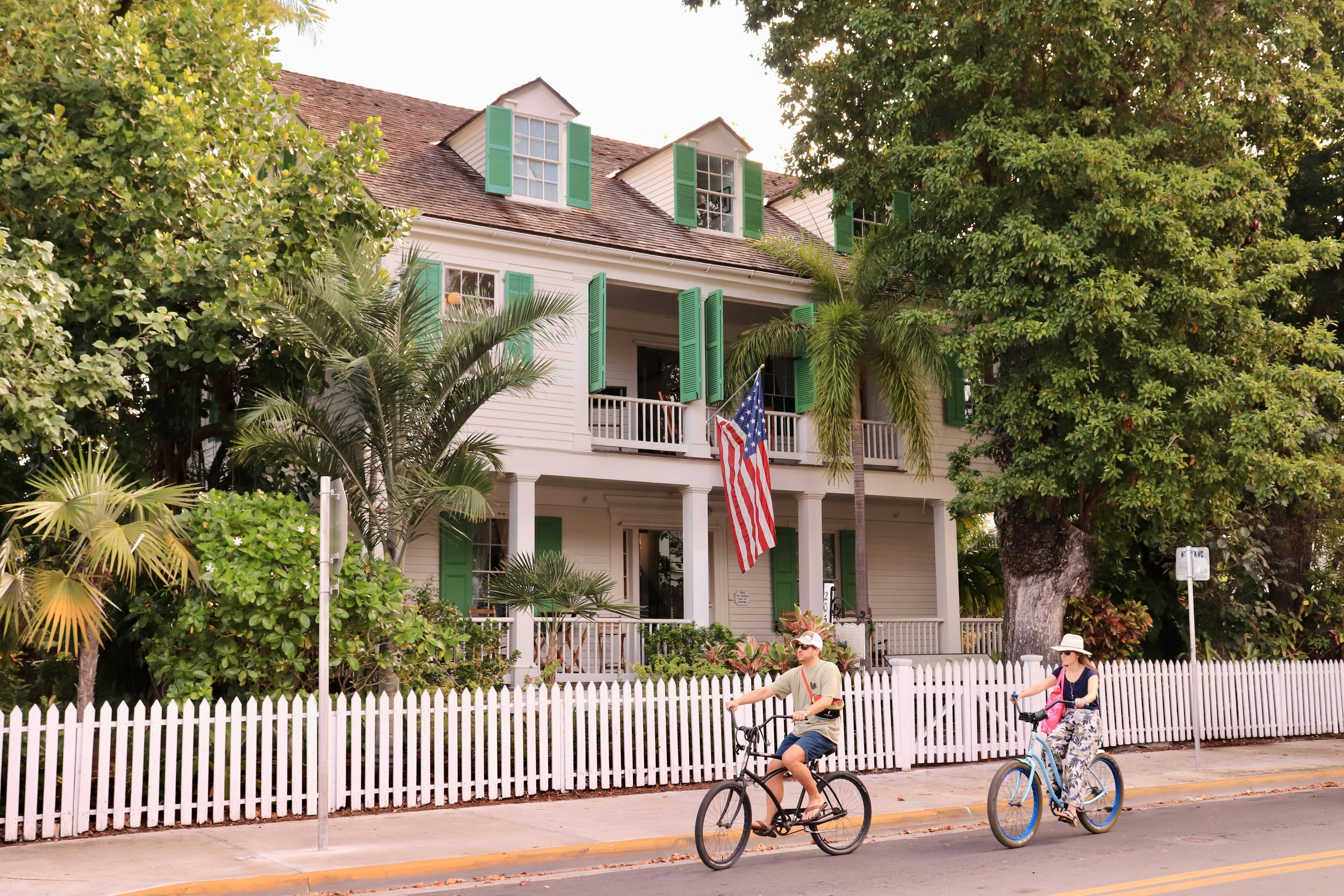 Key West, FL, USA. A typical wooden house in Key West, with american flag in the front door.