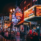 Nashville, TN, USA - April 2nd, 2023: Honky-tonks on Lower Broadway at night with its neon signs. The Country Music District is famous for its entertainment establishments and vibrant nightlife., License Type: media, Download Time: 2025-01-10T14:38:30.000Z, User: adouglaslott59, Editorial: true, purchase_order: 65050 - Digital Destinations and Articles, job: Future digital projects, client: Future digital projects, other: Ann Douglas Lott
