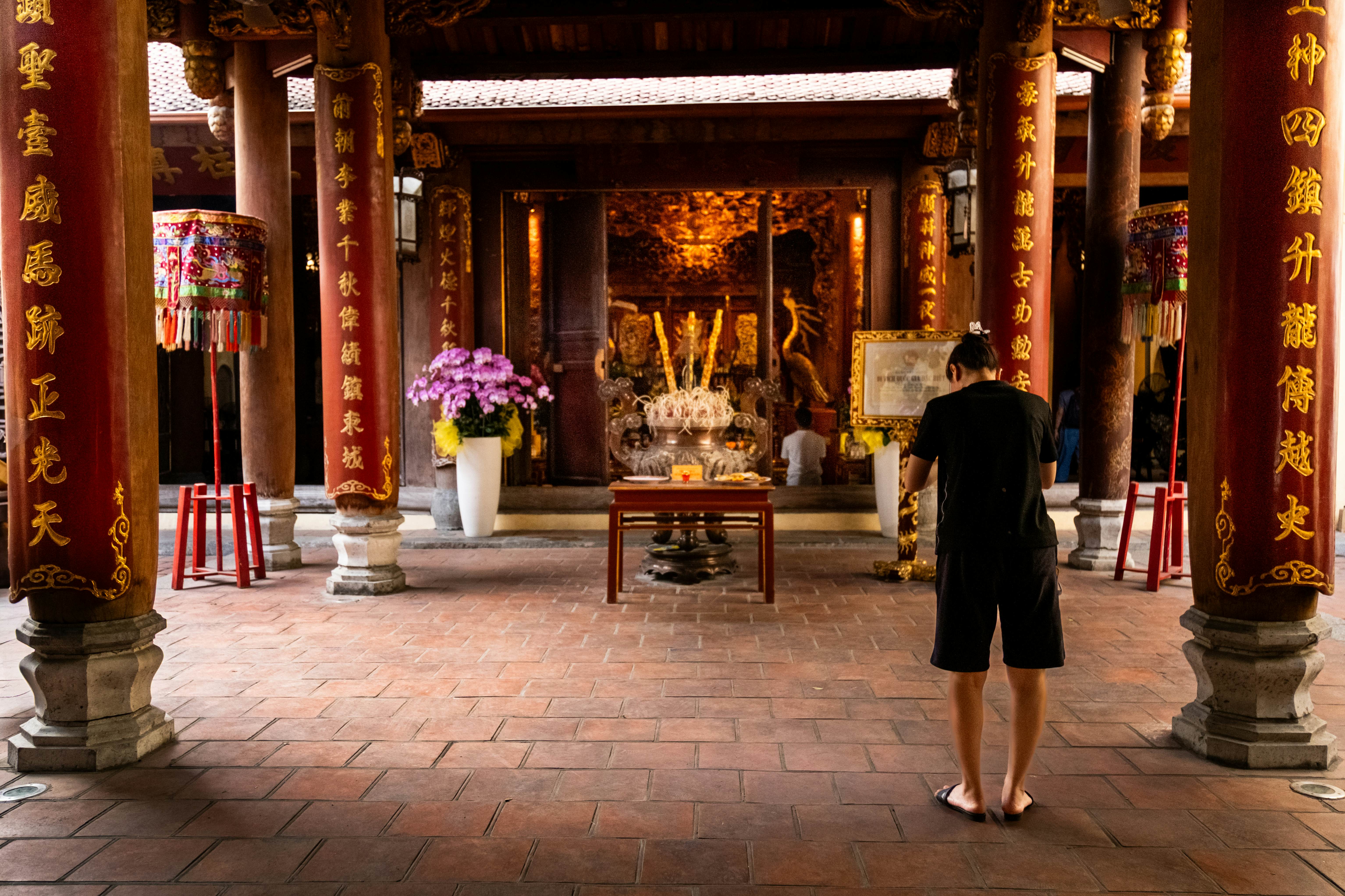 HANOI, VIETNAM — April 13, 2025
Praying in Bach Ma Temple, Hanoi