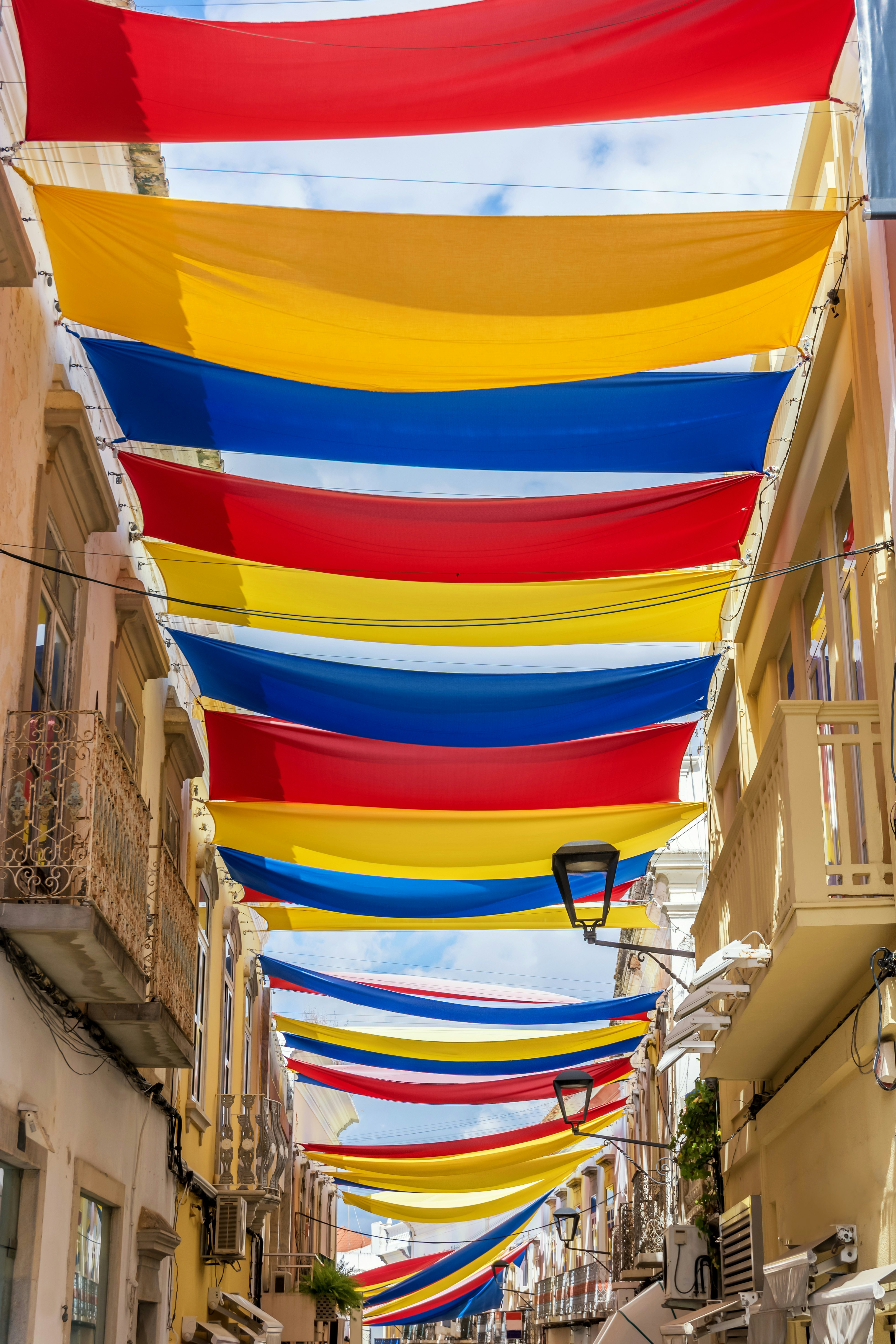 Downtown in the Portuguese city of Loulé with colorful sunshades in the streets