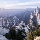 Huashan Mountain, China - May, 2017: The sunrise over Huashan mountain (Mt Hua) with several mountain peaks and the sun lighting the mountain peaks; Shutterstock ID 1777994309; purchase_order: 65050 - Digital Destinations and Articles; job: Lonely Planet Online Editorial; client: Best national parks in China; other: Brian Healy
1777994309
beautiful, blue, china, forest, green, hiking, hill, huashan, landscape, mountain, mountains, mt huashan, nature, outdoor, panorama, peak, rock, scenery, scenic, shanxi, sky, summer, sunrise, sunset, tourism, travel, view
Huashan Mountain, China - May, 2017: The sunrise over Huashan mountain (Mt Hua) with several mountain peaks and the sun lighting the mountain peaks