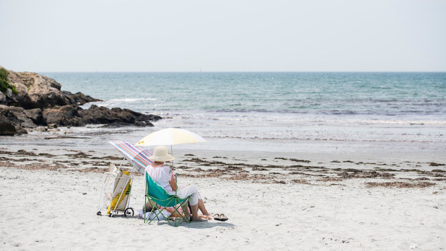 NEWPORT, RHODE ISLAND - MAY 15, 2023: Elderly couple enjoying isolated space on Rejects Beach, License Type: media, Download Time: 2025-02-28T21:36:25.000Z, User: rhylton_redventures, Editorial: true, purchase_order: 56530 - Guidebooks, job: Lonely Planet WIP, client: Lonely Planet WIP, other: Rhianydd Hylton