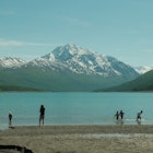 Anchorage, Alaska, United States - June 7th, 2024: Kid playing in water at Eklutna Lake, Anchorage Alaska in the summer, License Type: media, Download Time: 2025-05-14T17:29:55.000Z, User: rhylton_redventures, Editorial: true, purchase_order: 65050 - Digital Destinations and Articles, job: Lonely Planet , client: wip, other: Rhianydd Hylton