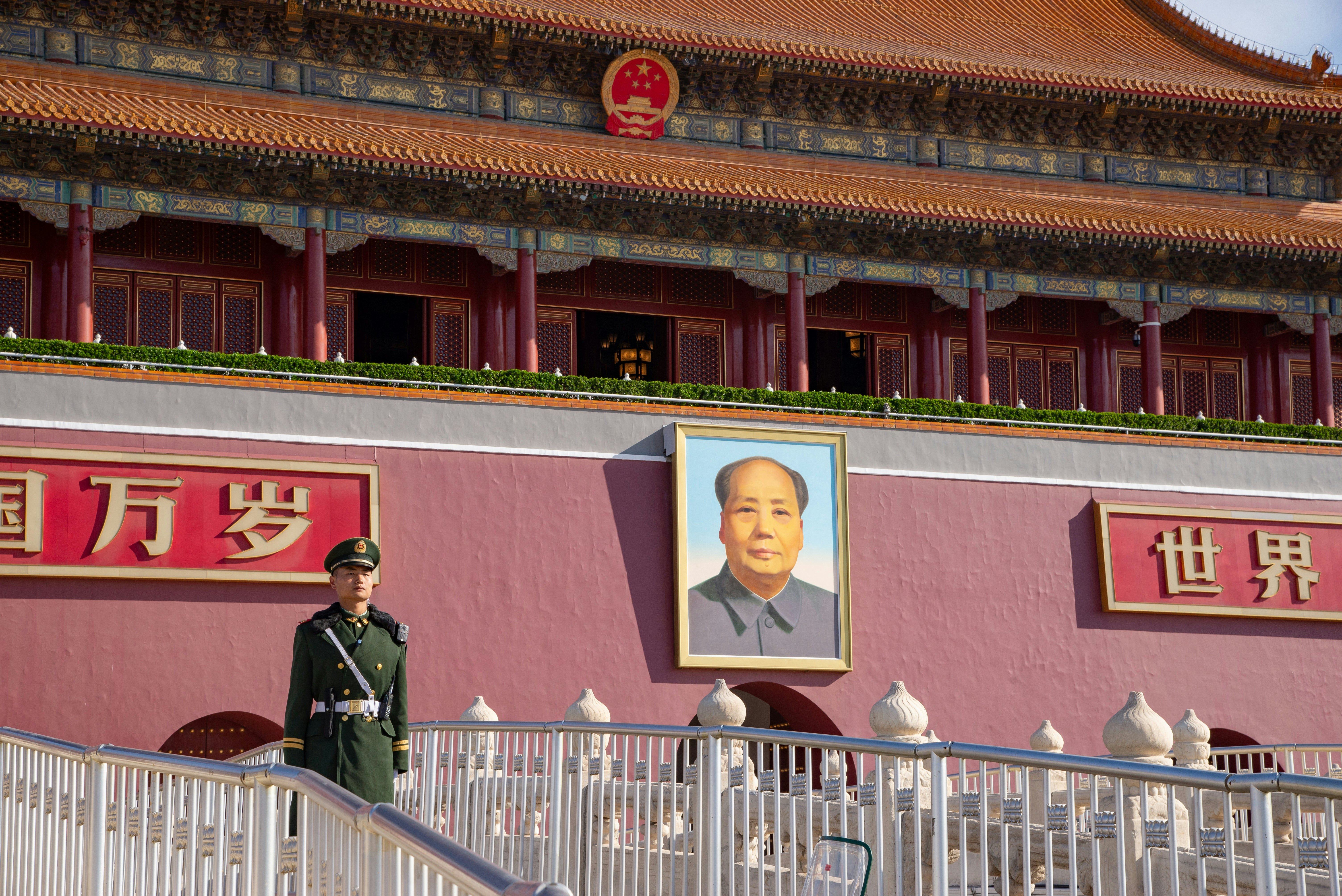 A soldier keeps watch over Tiananmen Square in front of the Gate of Heavenly Peace, Beijing, China.