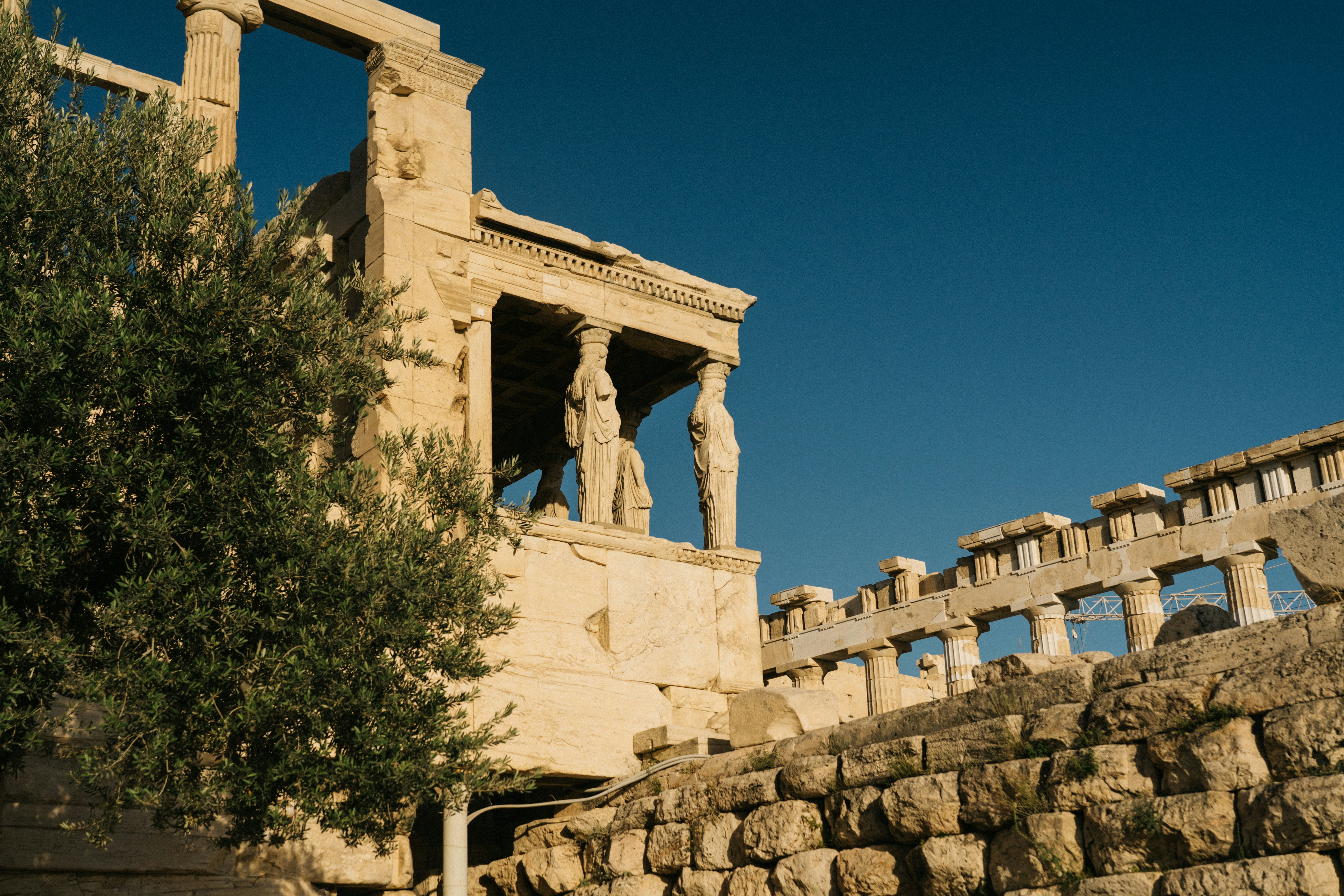 An overcast blue sky above the Shrine of the Muses, Athens