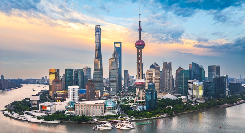 Aerial view of Shanghai financial district skyline with modern skyscrapers and river at sunset. - stock photo
Shanghai financial district skyline presents modern skyscrapers and river scenery during vibrant sunset hours.