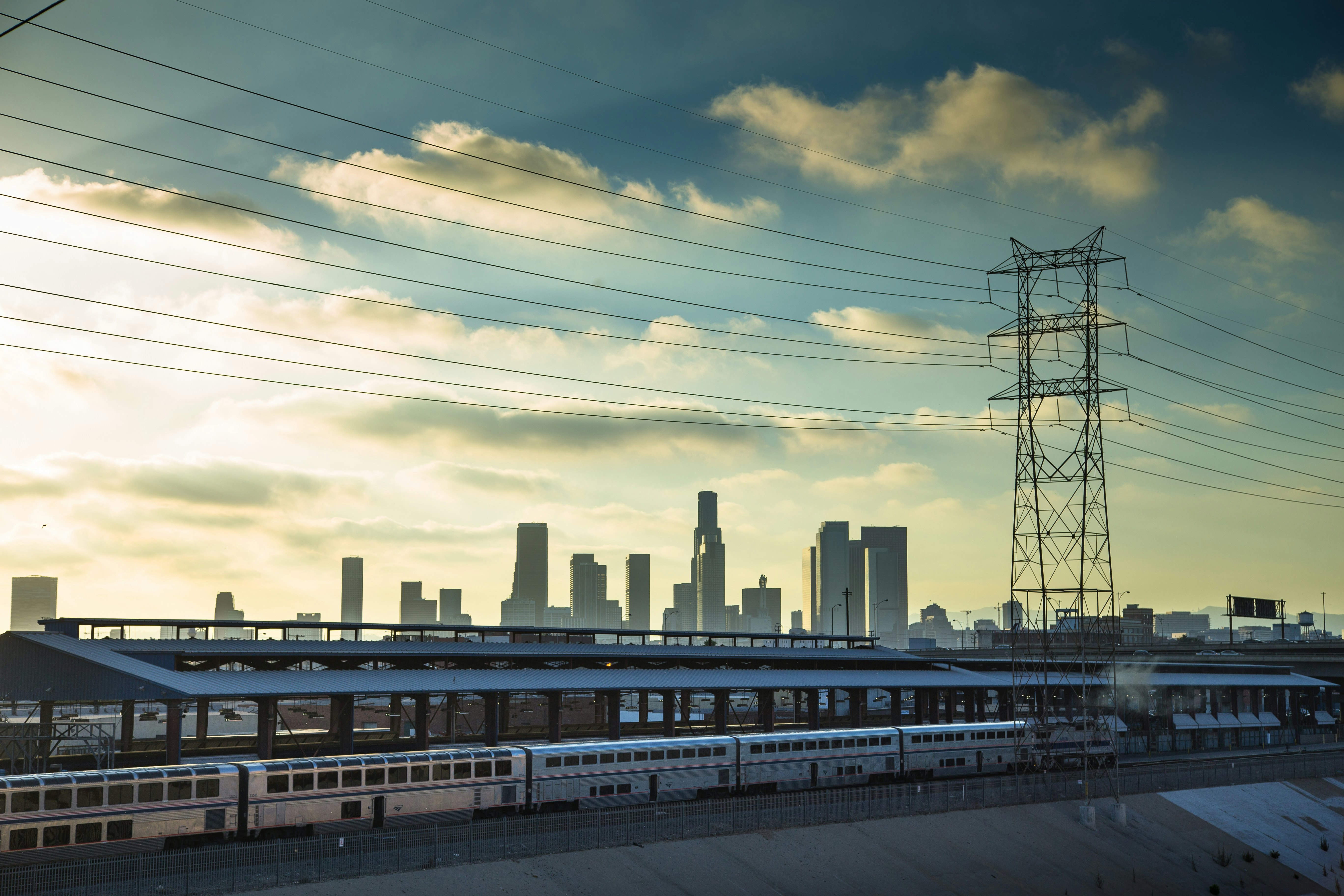 Image of Amtrak train in front of the Los Angeles skyline