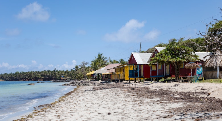 Colorful houses lined up on the beach. Little Corn Island, Nicaragua. May 2025.