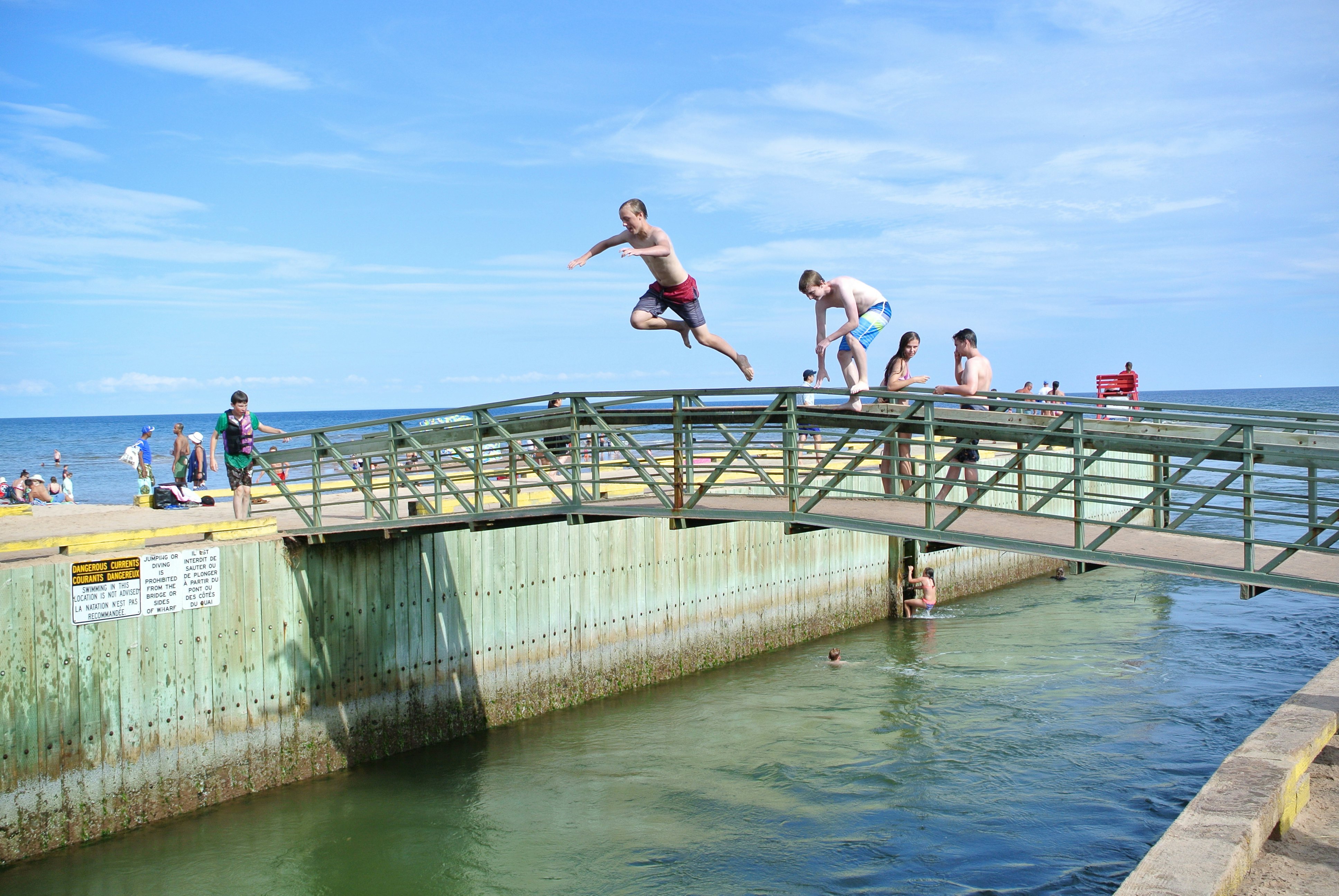 The Infamous Bridge Jumping at Singing Sands Beach, Basin Head Provincial Park, one of the top 10 beaches in Canada.