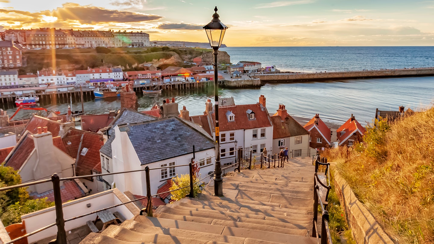 Whitby, North Yorkshire Coast, England 24th August 2018: Famous 199 steps at sunset over the harbour at Whitby License Type: media Download Time: 2023-06-13T23:42:44.000Z User: mvm_lonelyplanet Is Editorial: Yes purchase_order: 56530/Global Publishing-WIP