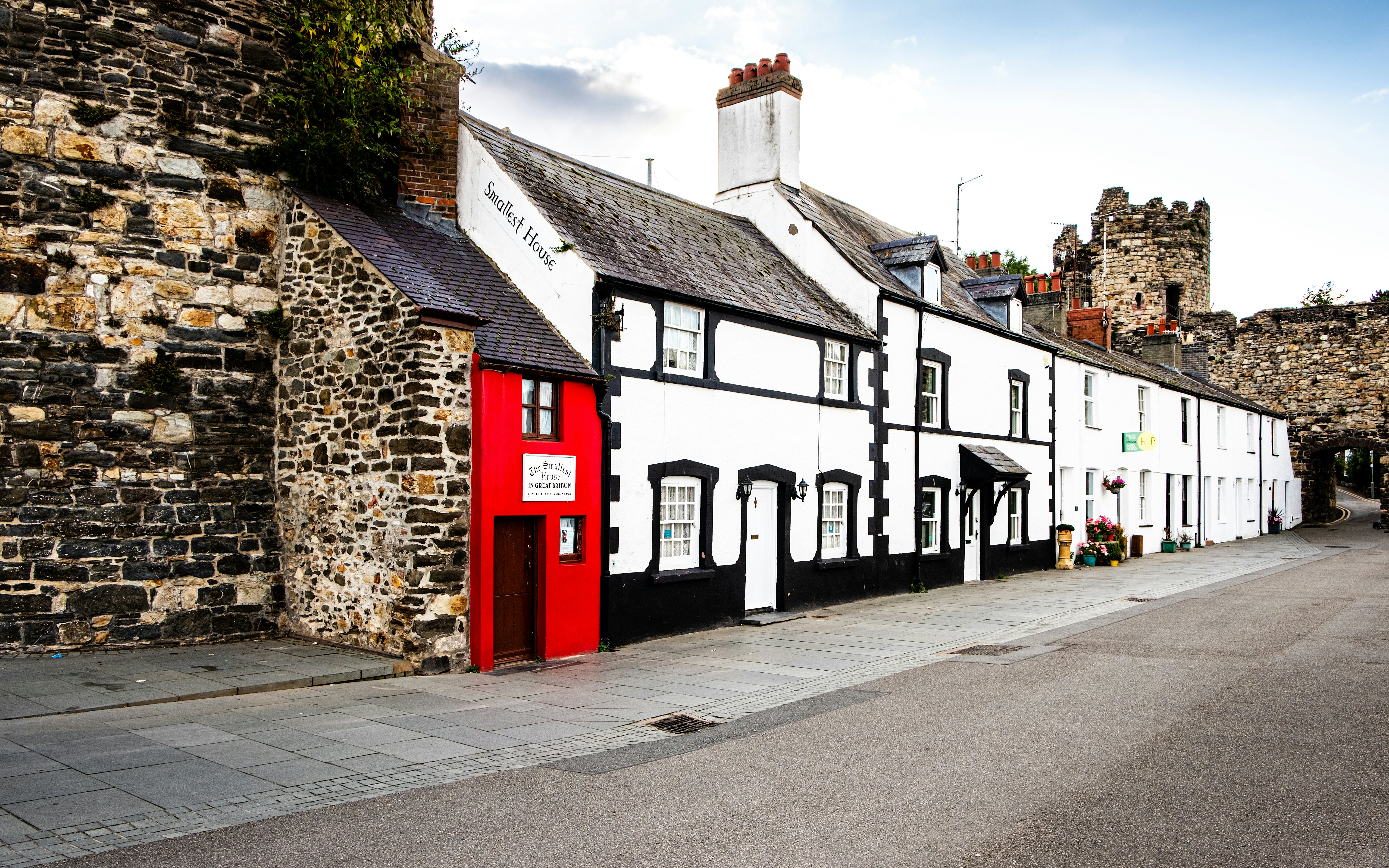 The Smallest House in Great Britain, also known as the Quay House, a scenic view of the tourist attraction on the quay in Conwy, North Wales.