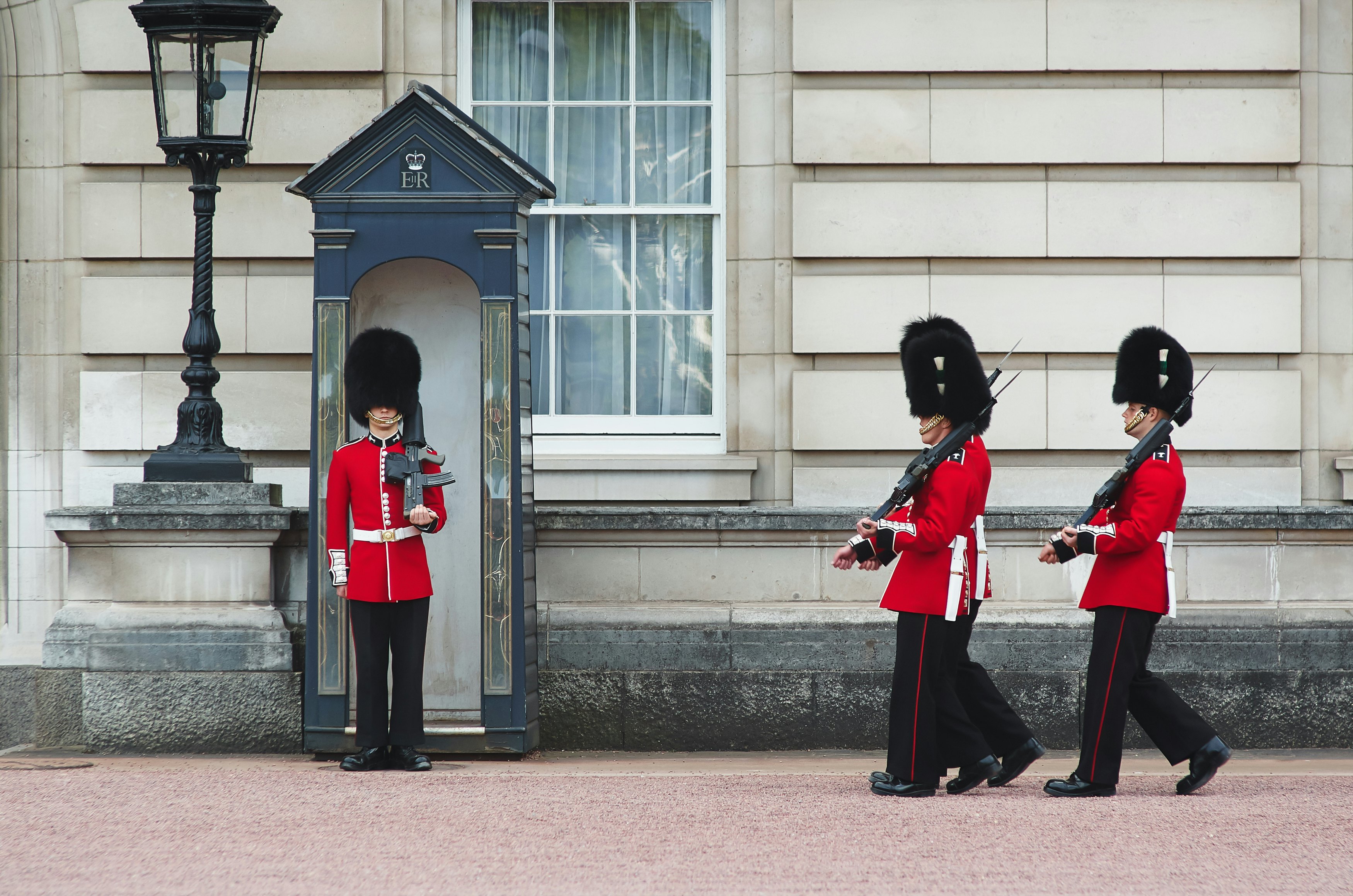 The Changing of the Guard ceremony at Buckingham Palace, London, England.