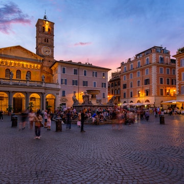 Basilica di Santa Maria in Trastevere and Piazza di Santa Maria in Trastevere at sunset, Rome, Italy. Trastevere is rione of Rome, on west bank of Tiber in Rome. Architecture and landmark of Rome. License Type: media Download Time: 2024-05-09T09:57:18.000Z User: FergalCo Is Editorial: No purchase_order: