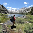 Enjoying the View at Long Lake in Little Lakes Valley, John Muir Wilderness, California, USA  License Type: media  Download Time: 2021-08-23T02:27:27.000Z  User: mvm_lonelyplanet  Is Editorial: No  purchase_order:
