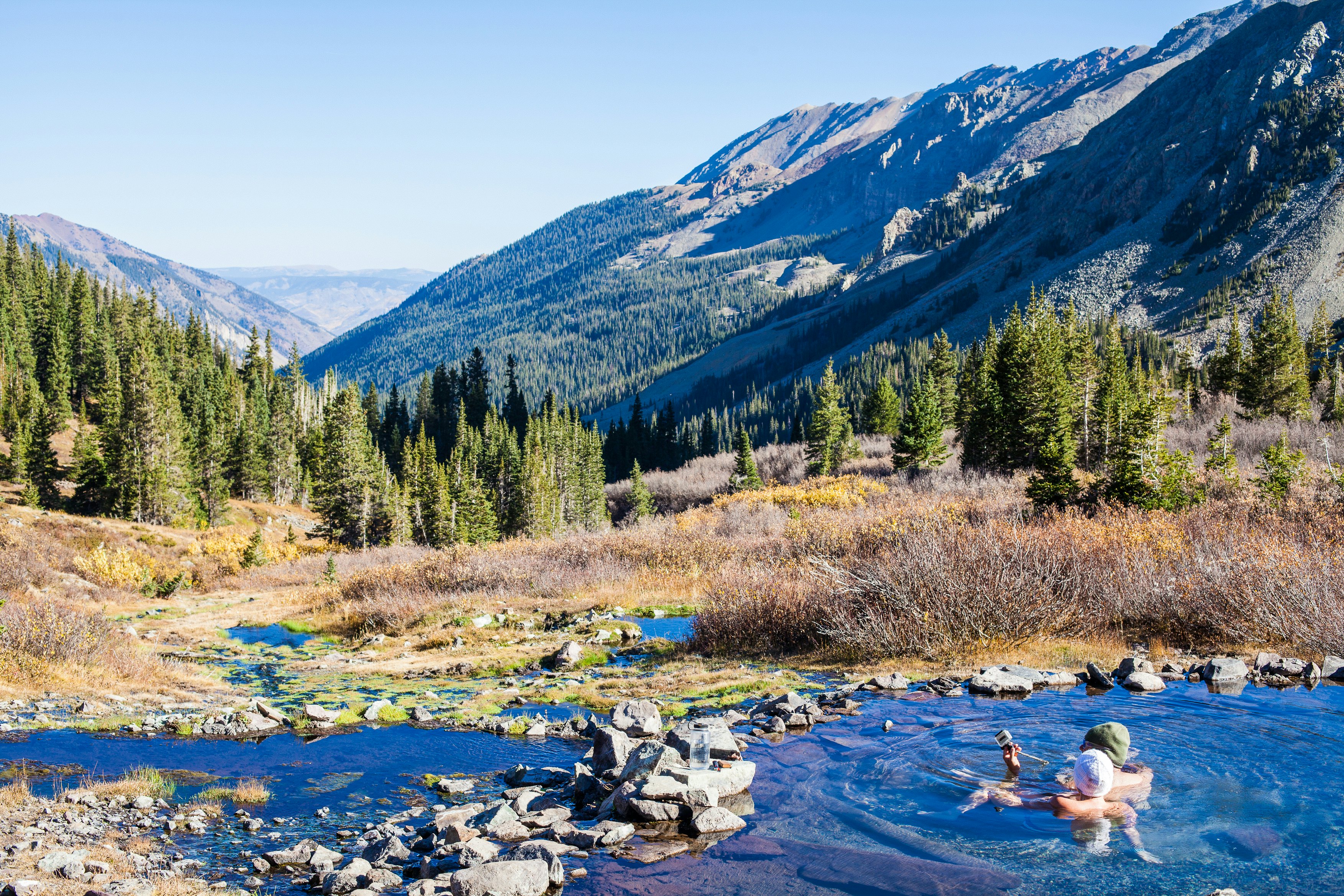 A couple enjoying Conundrum Hot Springs, Aspen, Colorado