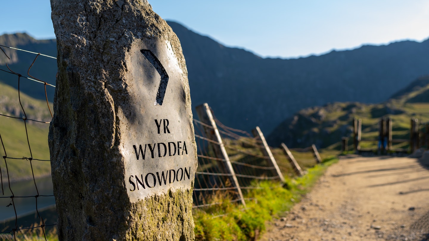 Yr Wyddfa Snowdon Sign along the Pyg Track Path ascending the mountain in Snowdonia (Eryri) National Park Wales (Cymru) near Sunset, License Type: media, Download Time: 2025-01-13T02:31:58.000Z, User: claramonitto, Editorial: false, purchase_order: 56530 - Guidebooks, job: Global Publishing-WIP, client: Great Britain 16, other: Clara Monitto
