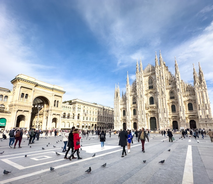 Milan Italy - Jan 22 2024: People walk in the Piazza del Duomo in front of the Duomo di Milano, the catholic cathedral in the city in Italy., License Type: media, Download Time: 2024-12-16T19:01:07.000Z, User: comptonsheldon109, Editorial: true, purchase_order: 56530 - Guidebooks, job: Global Publishing WIP, client: Italian Lakes 4, other: Compton Sheldon