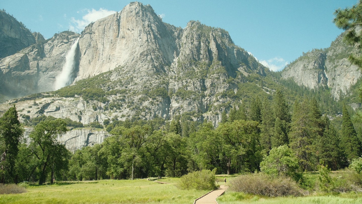 Yosemite National Park in California’s Sierra Nevada mountains green foliage on sunny day with waterfall, License Type: media, Download Time: 2025-05-14T17:29:55.000Z, User: rhylton_redventures, Editorial: false, purchase_order: 65050 - Digital Destinations and Articles, job: Lonely Planet , client: wip, other: Rhianydd Hylton