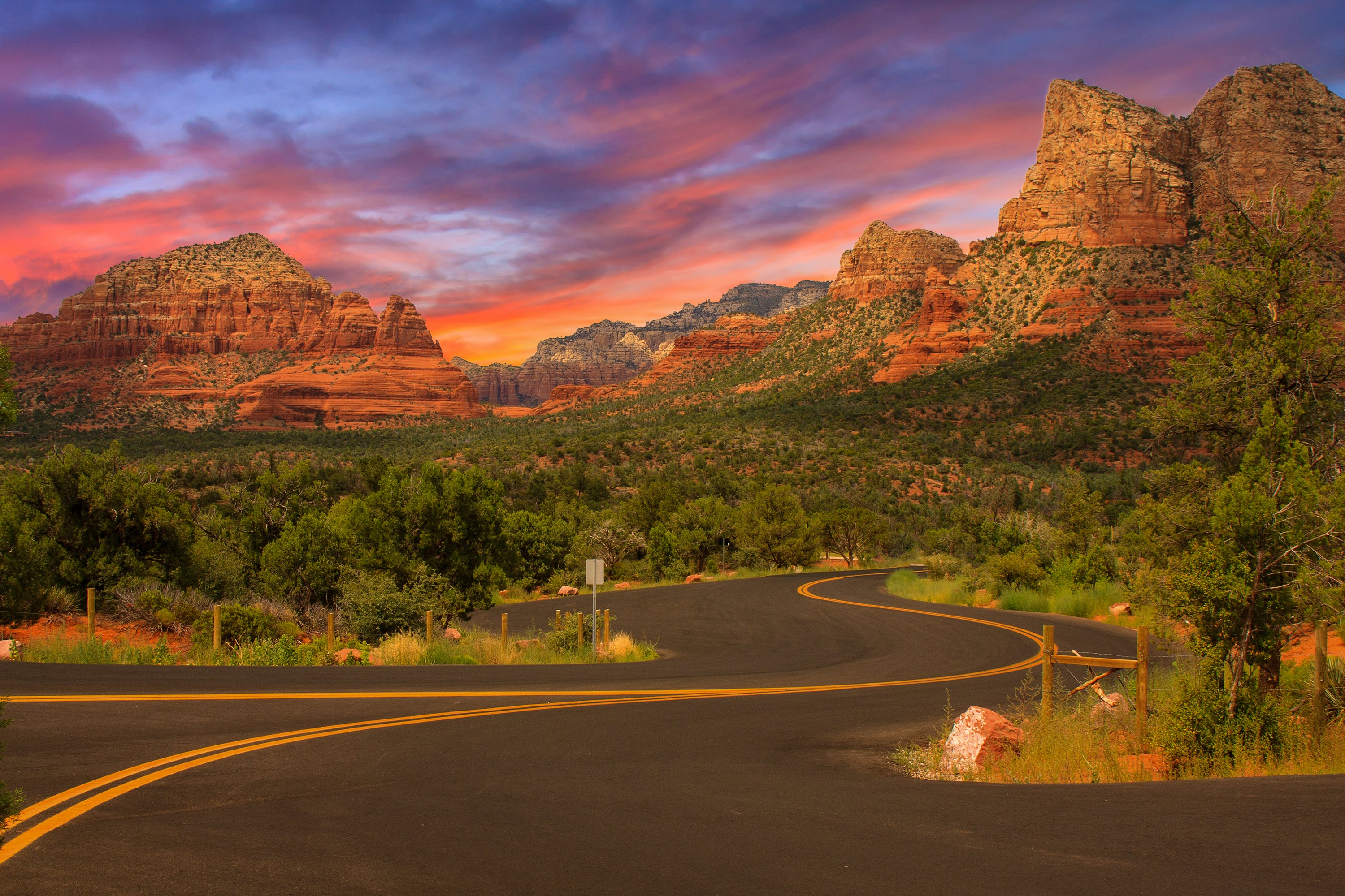 Curve through and around the awe-inspiring sandstone rocks along the Red Rock Scenic Byway (State Route 179)