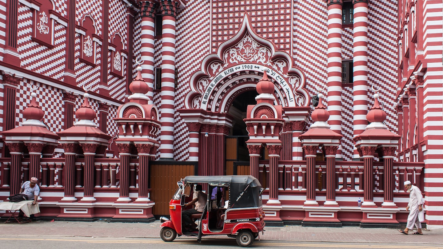 653732554
RFE, Shutterstock, architecture, asia, autorickshaw, building, busy, ceylon, city, colombo, colorful, decoration, district, dome, facade, islam, jami-ul-alfar, landmark, lanka, mosque, muslim, old, pattern, people, pettah, red, religion, sri, street, travel, tuk, urban, Arch, Gothic Arch, Handbag, Hat, Motorcycle, Person, Shoe, Vehicle