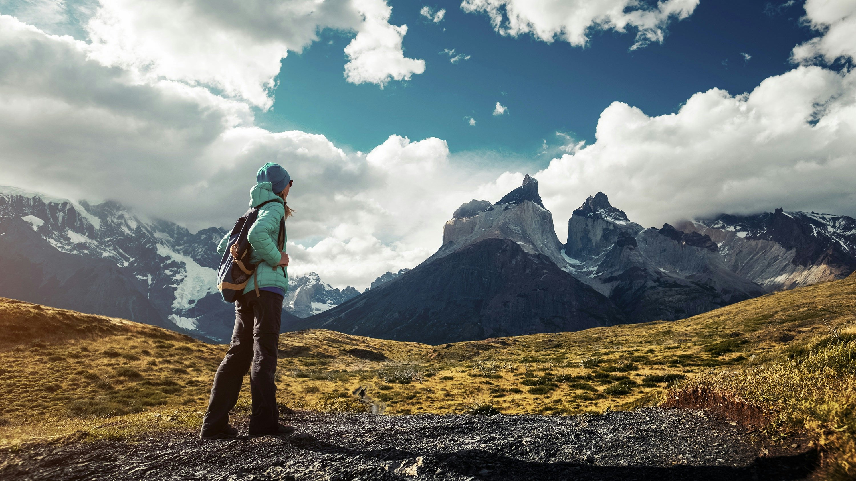A female hiker on a trail at Torres del Paine National Park