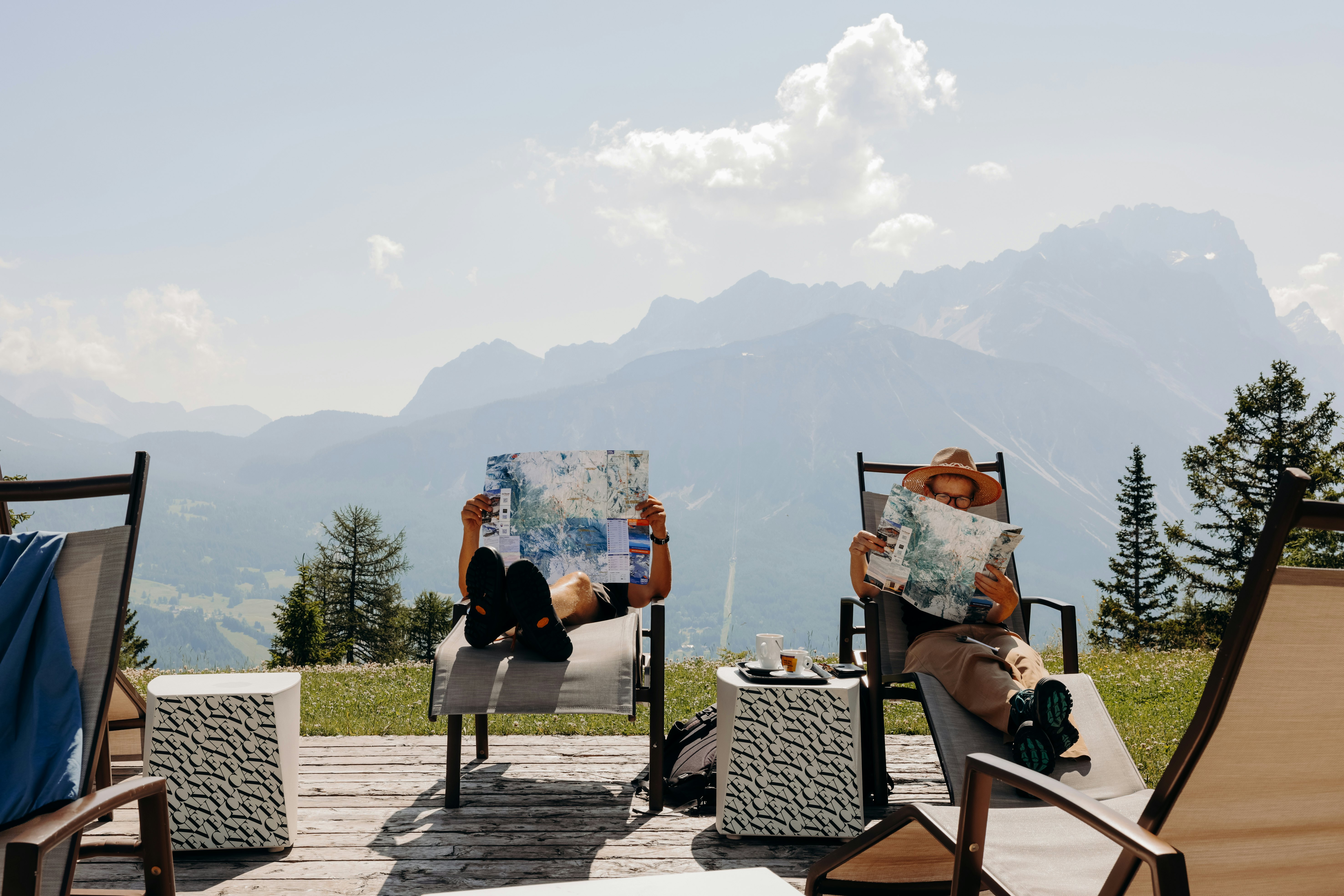 Cortina d'Ampezzo, Italy. June 2025. ..At Col Druscié stop (1778m), people enjoy the sun and relax. The Freccia nel Cielo (Arrow in the Sky) lift, which reaches the top of the Tofane Mountains and has three stops: Col Druscié at 1778m, Ra Valles at 2470m and Tofana di Mezzo at 3244m...Photo by Camilla Ferrari for Lonely Planet