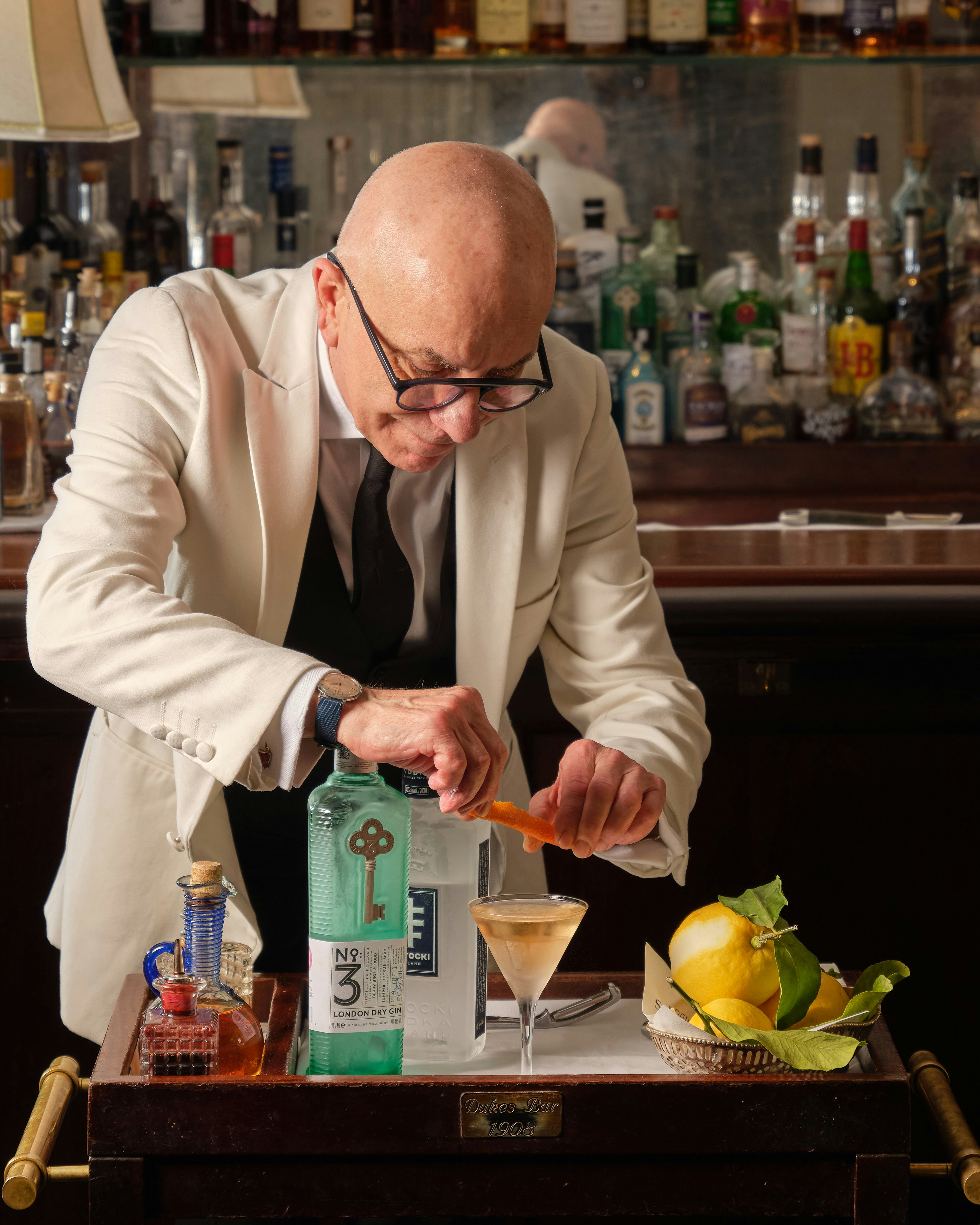 DUKES bartender Alessandro Palazzi finishes making a cocktail at DUKES Bar in London
