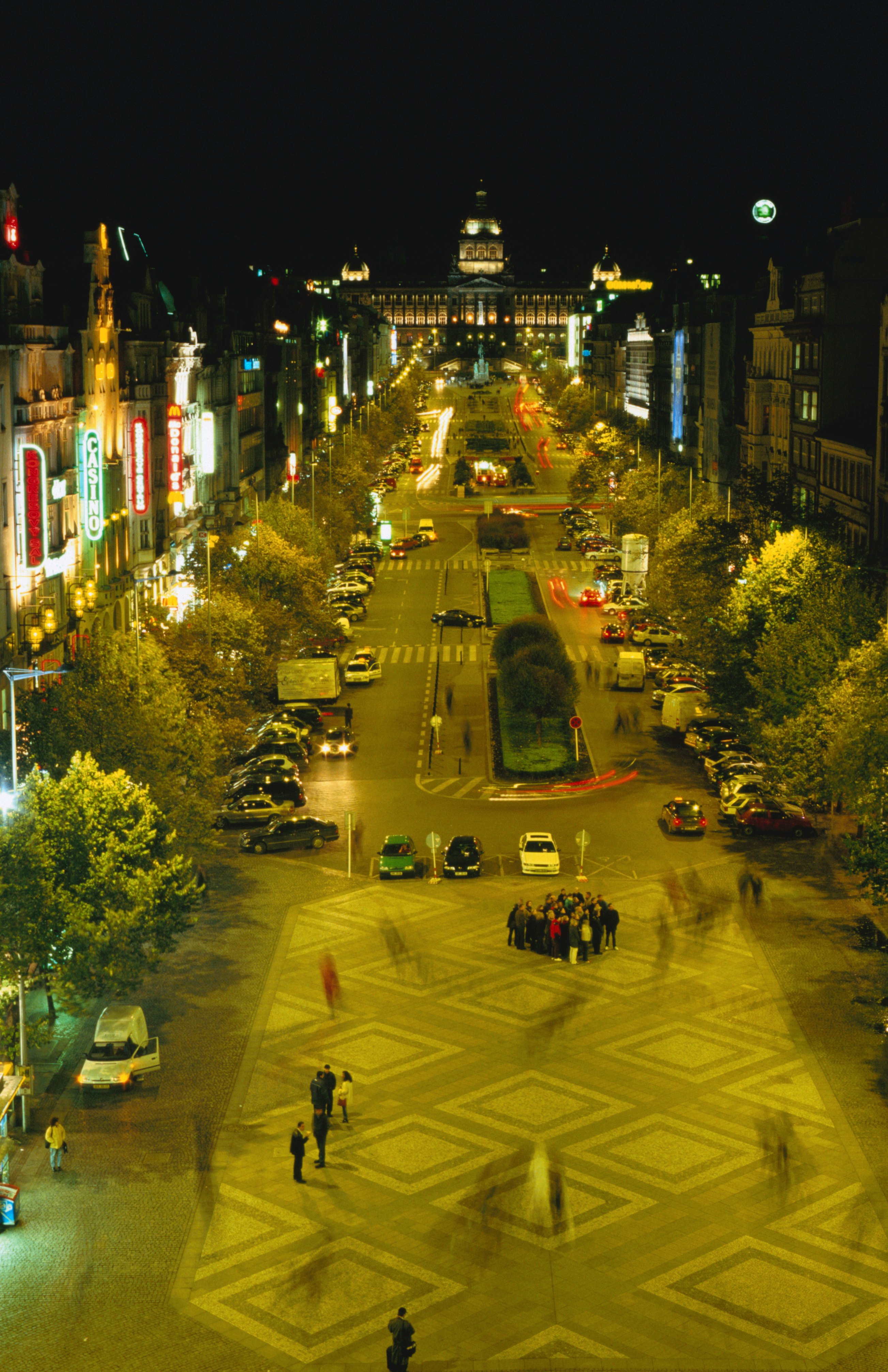 A bustling city square at night