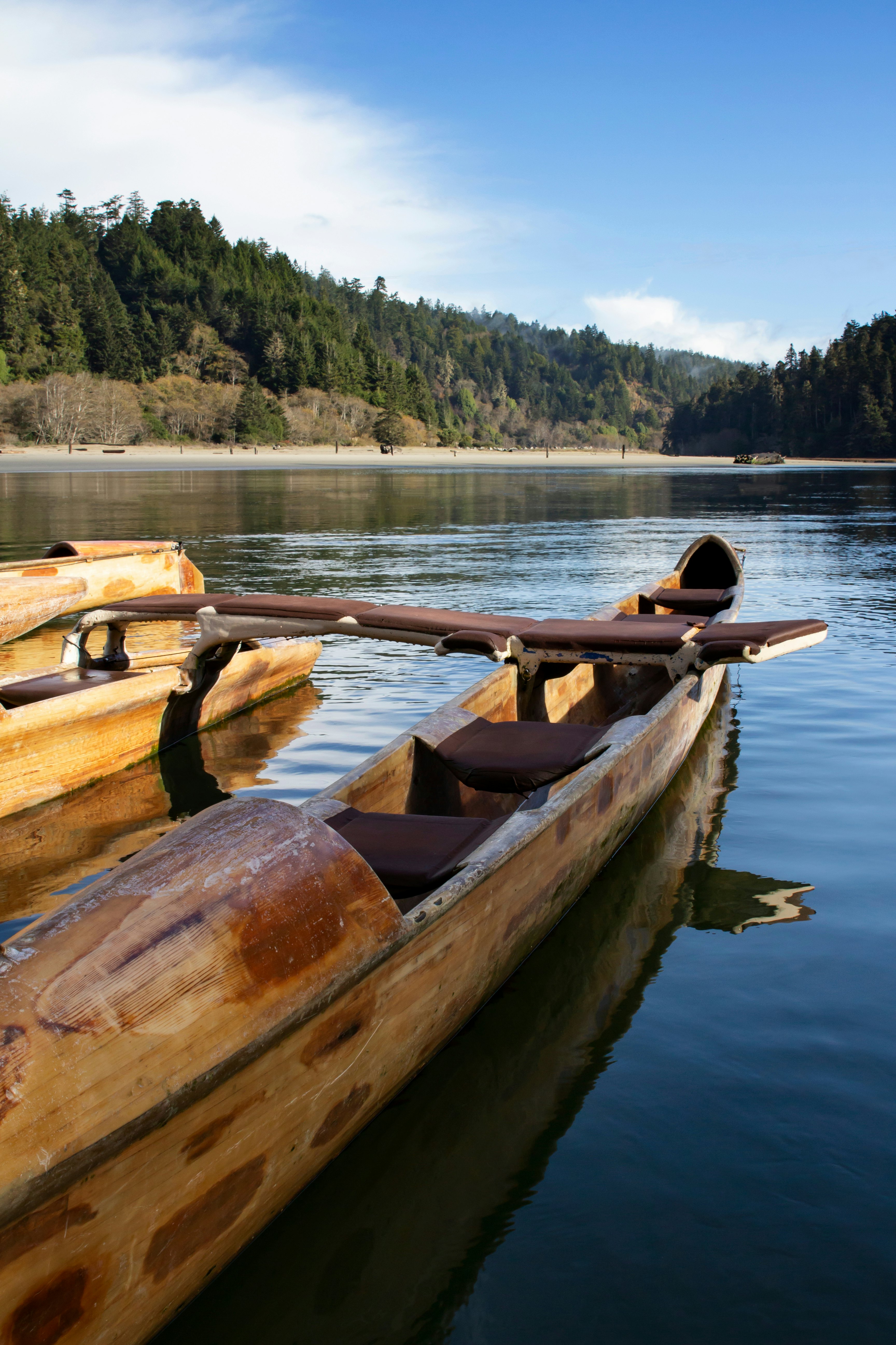 A wooden canoe on river in California.