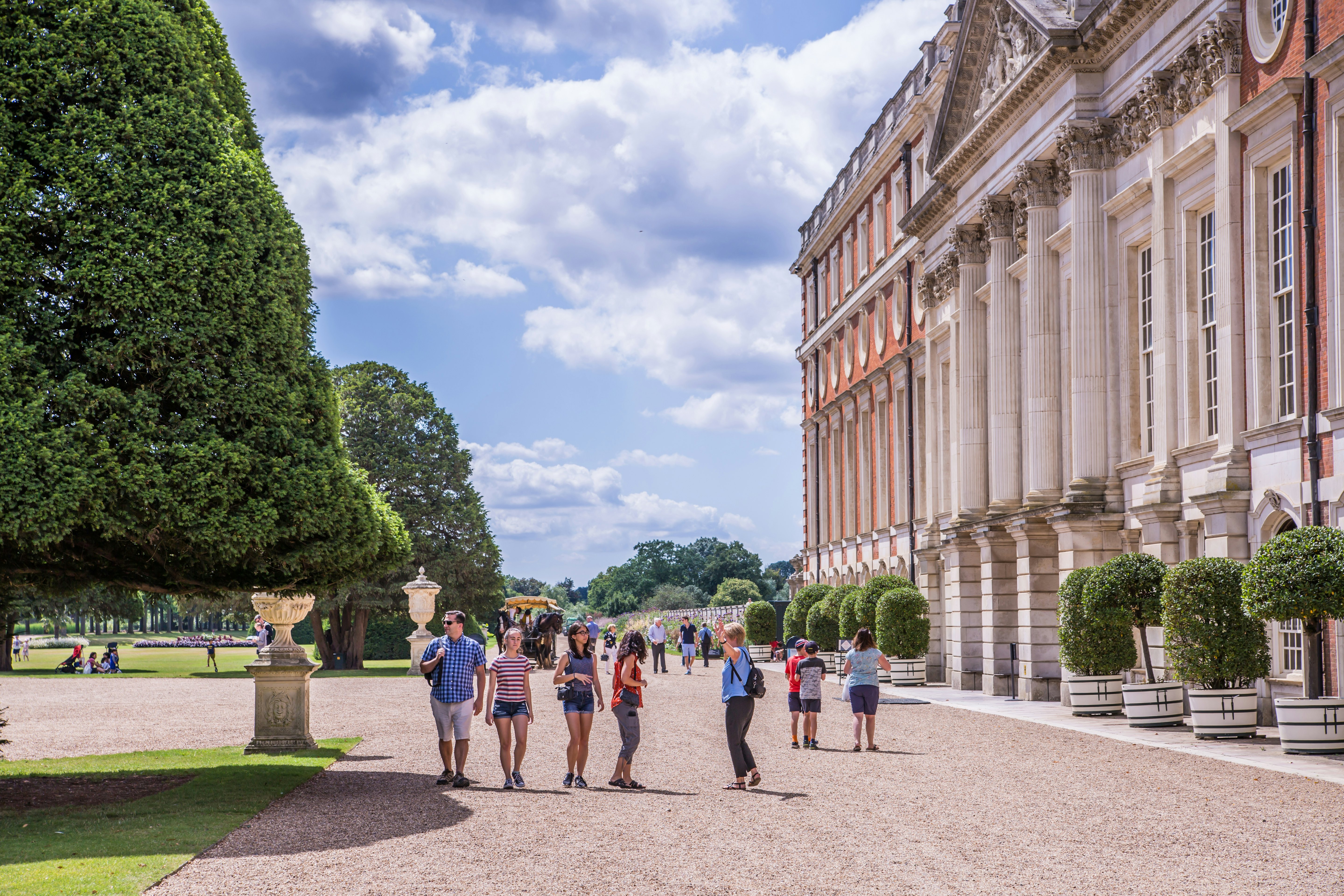 View of the gardens and the East Front of Hampton Court Palace, London, England.
