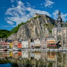 View of picturesque Dinant town, Dinant Citadel and Collegiate Church of Notre Dame de Dinant over the Meuse river. Belgian province of Namur, Blegium License Type: media Download Time: 2024-05-22T09:36:31.000Z User: clairenaylor Is Editorial: No purchase_order: