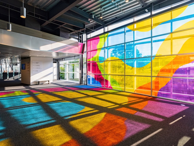 Multicolored glass casts colorful shadows in a museum in New York.