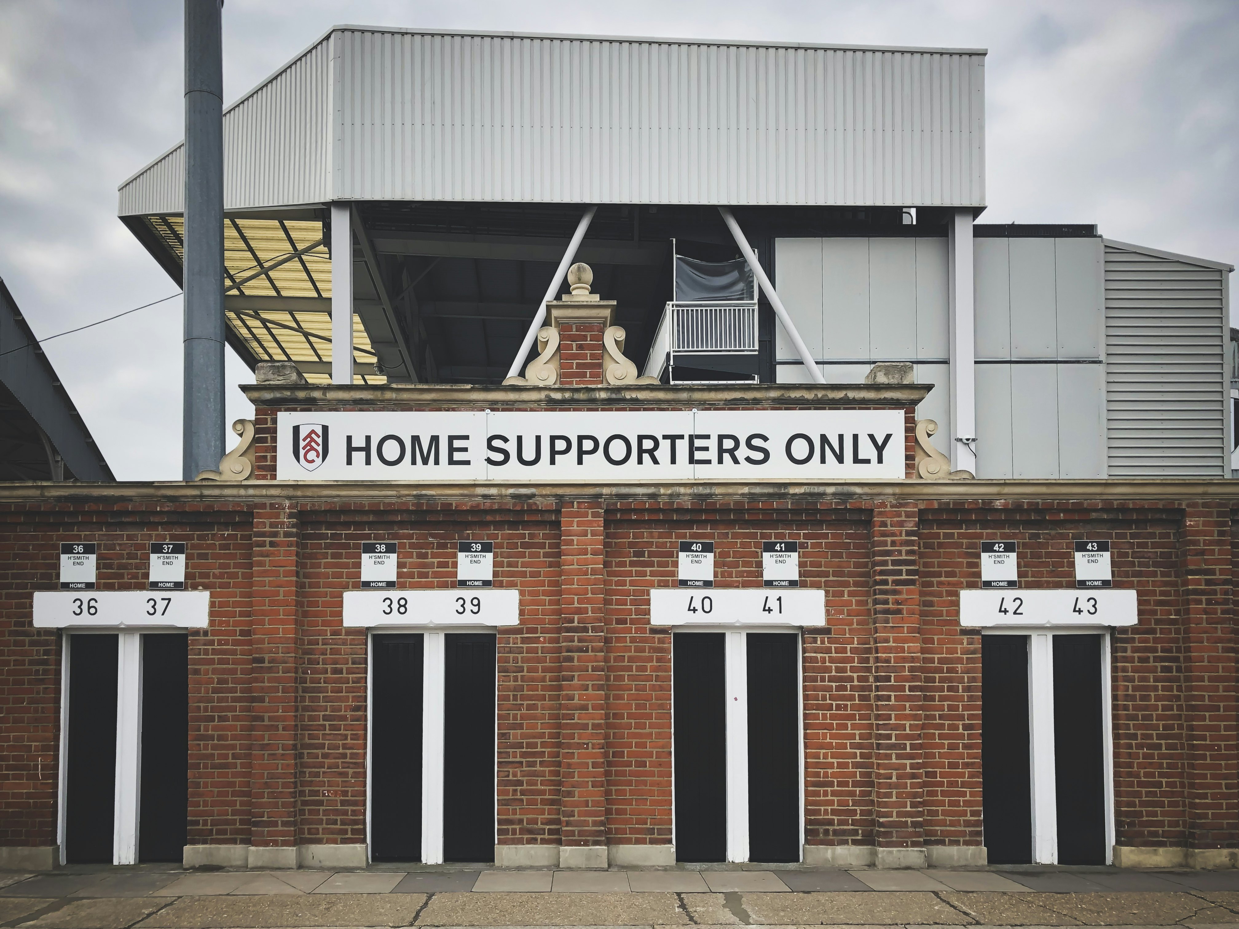 View of the entrance to Fulham's Craven Cottage stadium in London, England.