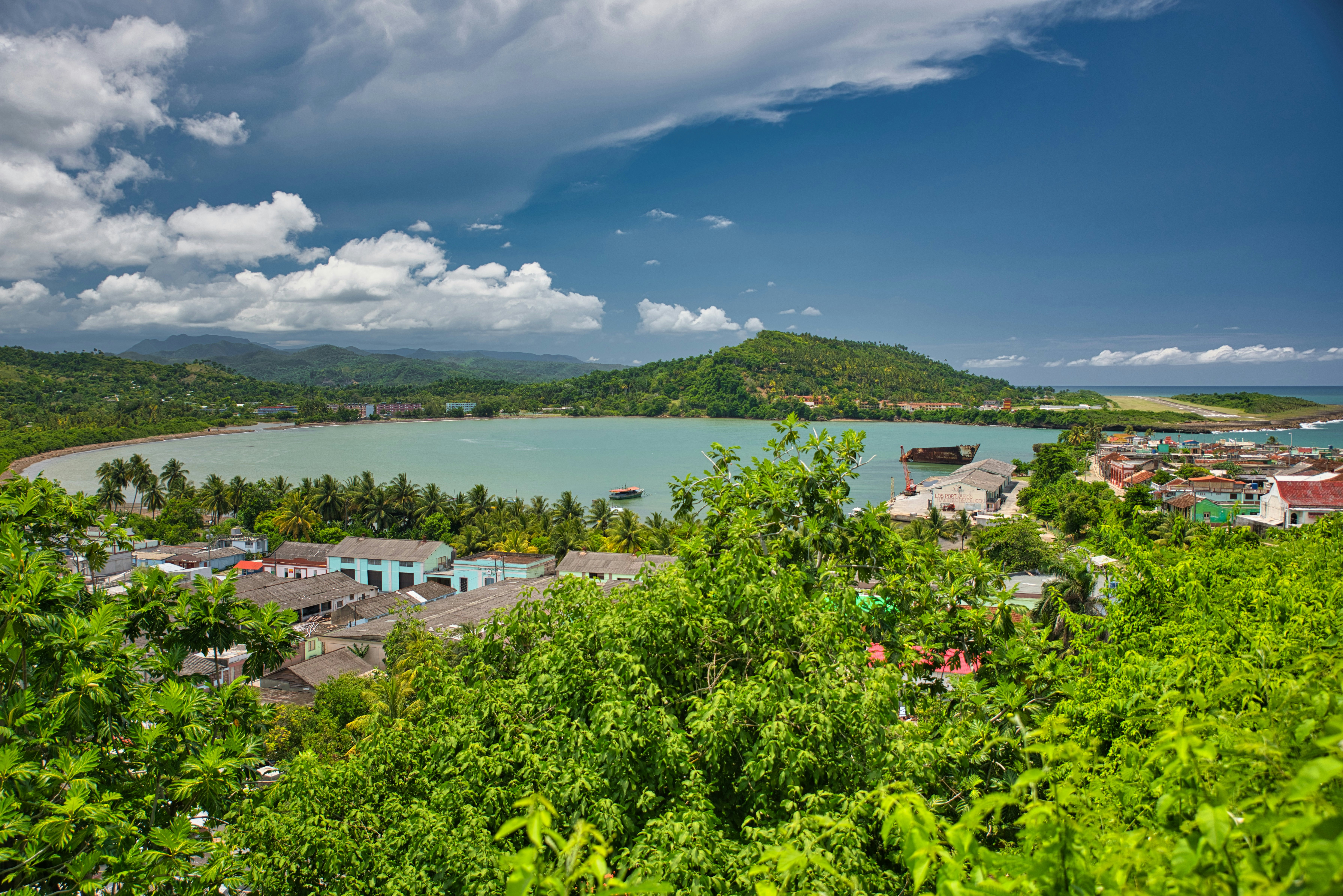 Baracoa, Cuba - May 30, 2015: Deep green forests on the mountains and hills with beautiful big white clouds above them, with the view on Bay of Honey, on a beautiful day, in Baracoa, Cuba., License Type: media, Download Time: 2025-07-31T16:17:58.000Z, User: rhylton_redventures, Editorial: true, purchase_order: 65050 - Digital Destinations and Articles, job: Lonely Planet, client: wip, other: Rhianydd Hylton