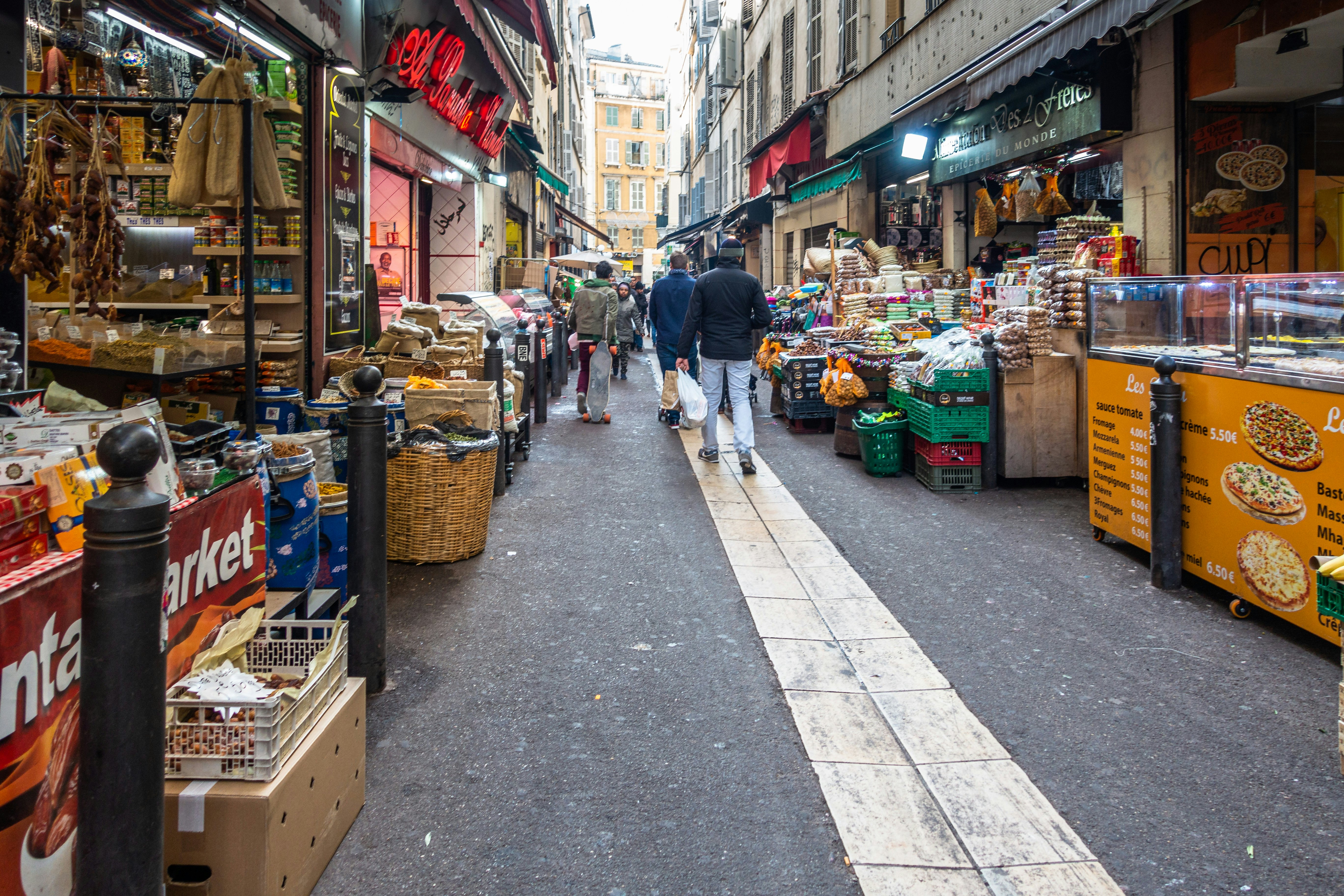 View of Marseille's Noailles quarter with African shops and boutique lined along the street.