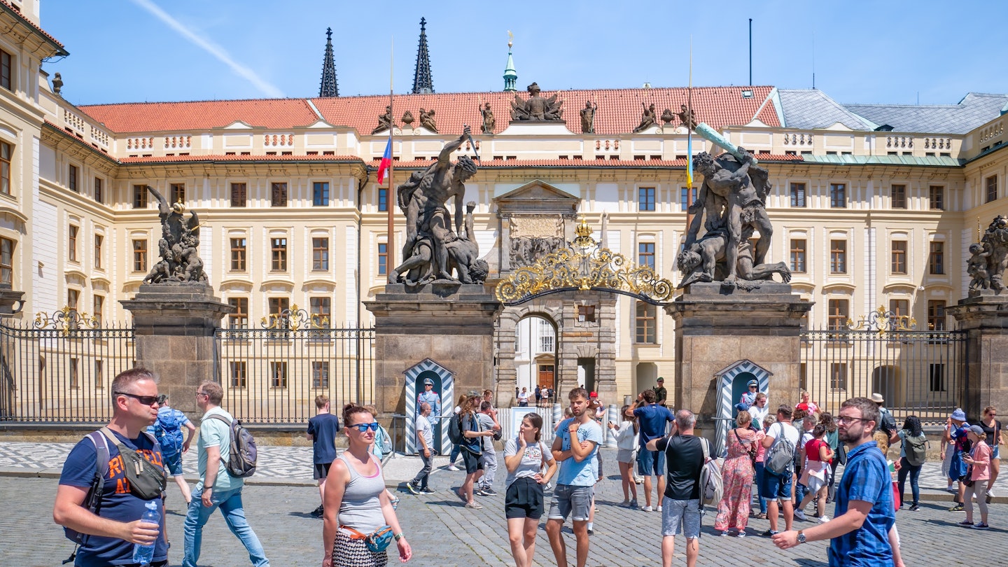Prague, Czech Republic - June 2022: The guarded entrance of the New Royal Palace part of Prague Castle. Tourists in Prague, License Type: media, Download Time: 2025-02-06T17:46:06.000Z, User: fabricencoredesign31, Editorial: true, purchase_order: 56530 - Guidebooks, job: Global Publishing WIP, client: Pocket Prague 8, other: Fabrice Robin