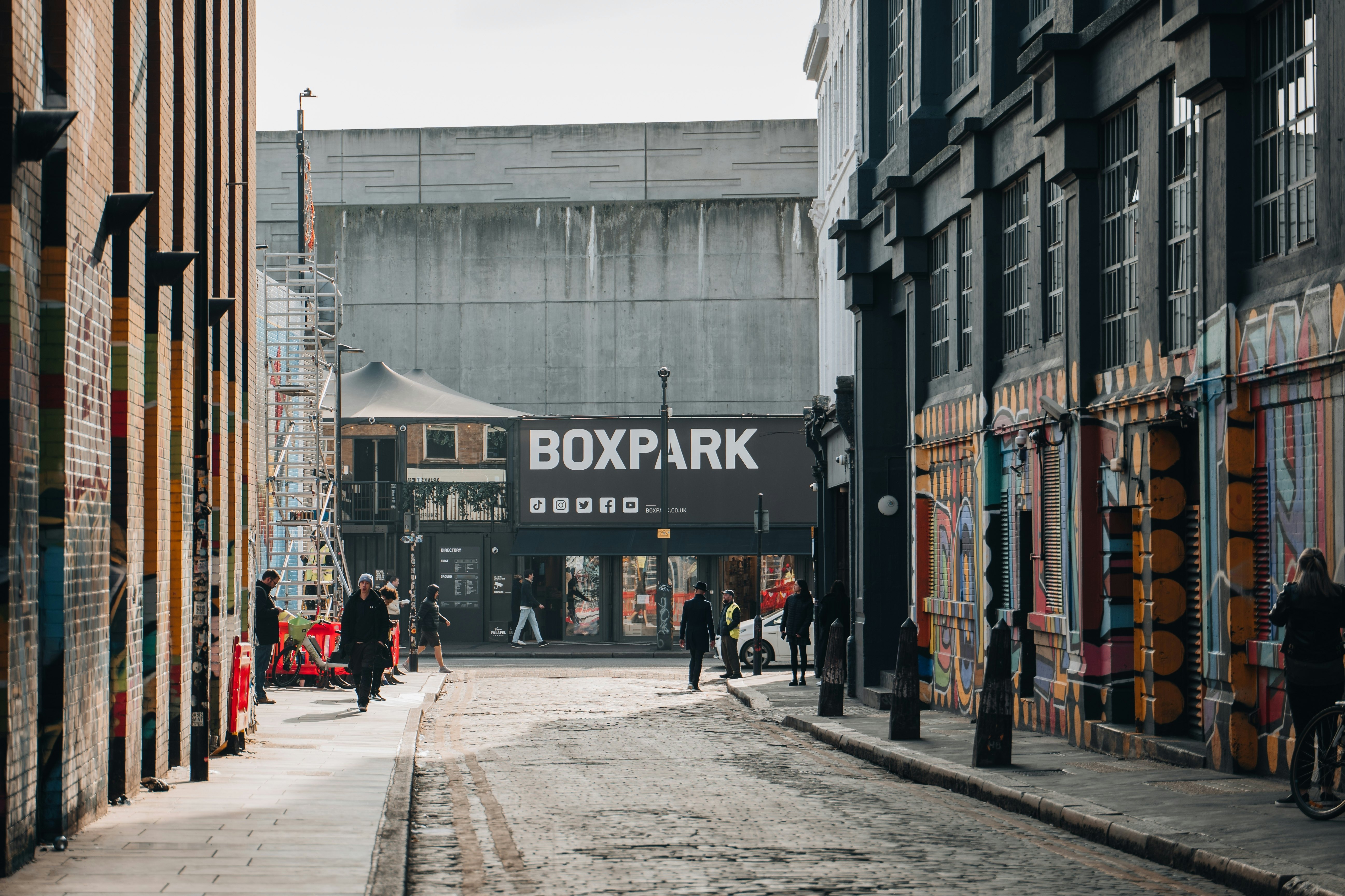View of Boxpark Shoreditch, a shipping container mall for independent fashion and lifestyle stores and cafes, from a nearby street
