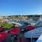 July 20, 2022:Ogunquit, Maine-USA: A high shot of Perkins Cove of fishing boats and visitors in summertime., License Type: media, Download Time: 2024-09-09T04:38:05.000Z, User: Norma.PrauseBrewer_LonelyPlanet, Editorial: true, purchase_order: 56530, job: Global Publishing WIP, client: New England 11, other: Norma Brewer