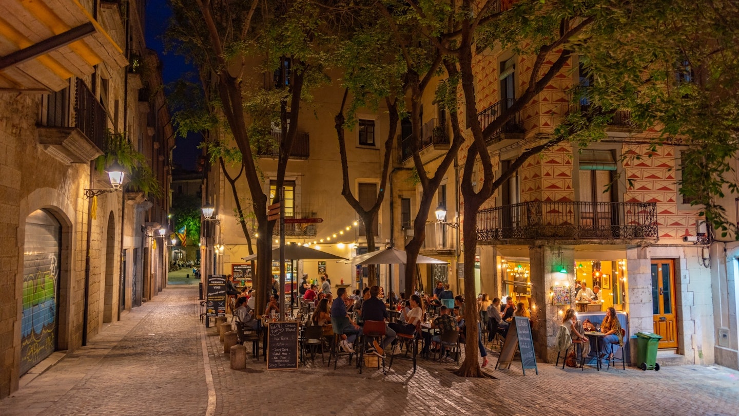 Girona, Spain, May 26, 2022: Night view of a medieval street in Spanish town Girona., License Type: media, Download Time: 2025-07-14T10:30:58.000Z, User: sashabrady26, Editorial: true, purchase_order: 65050 - Digital Destinations and Articles, job: Lonely Planet, client: Why you should visit Girona, other: Sasha Brady