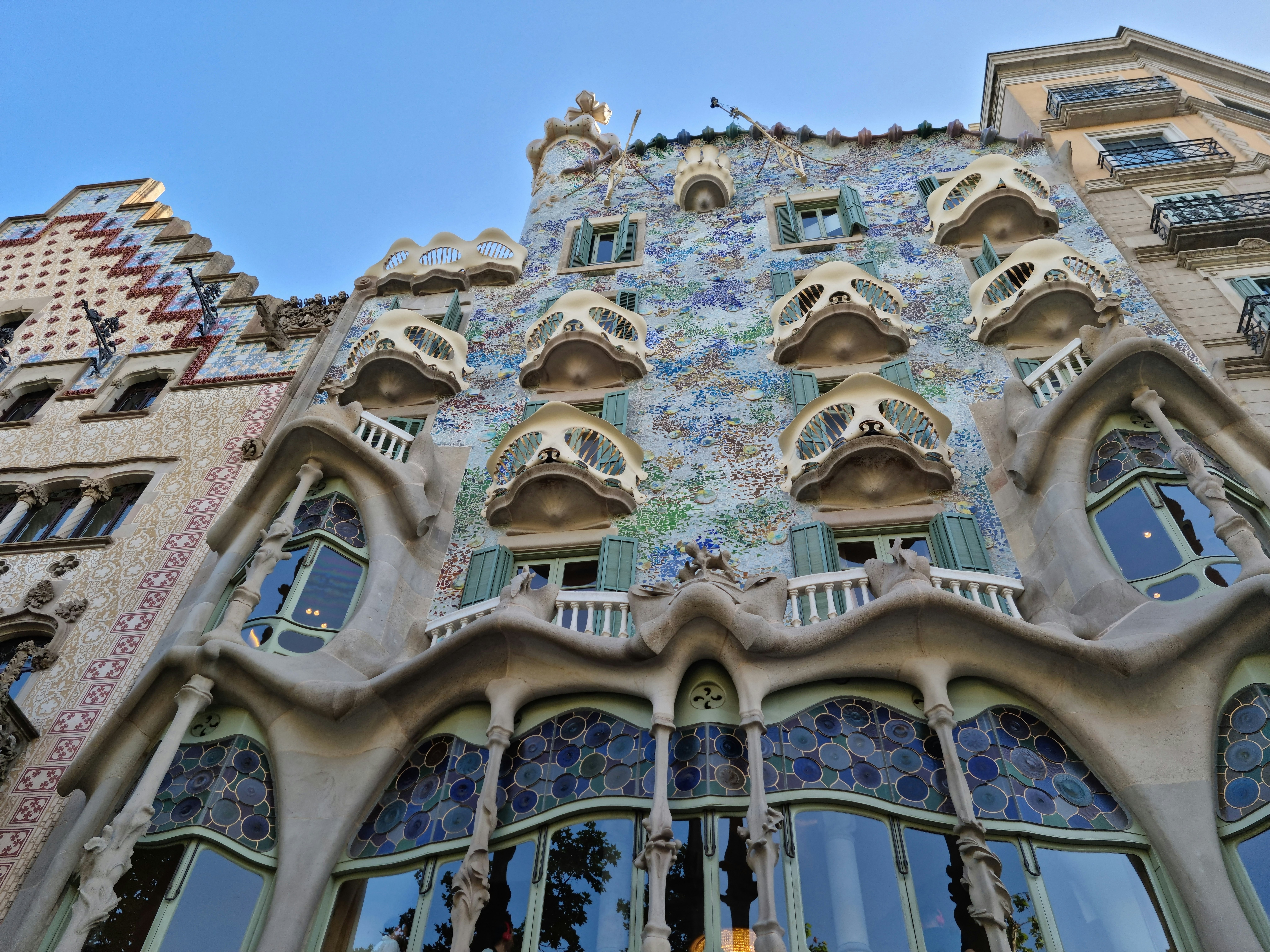 The blue and green decorative exterior of a Modernista building in Barcelona.