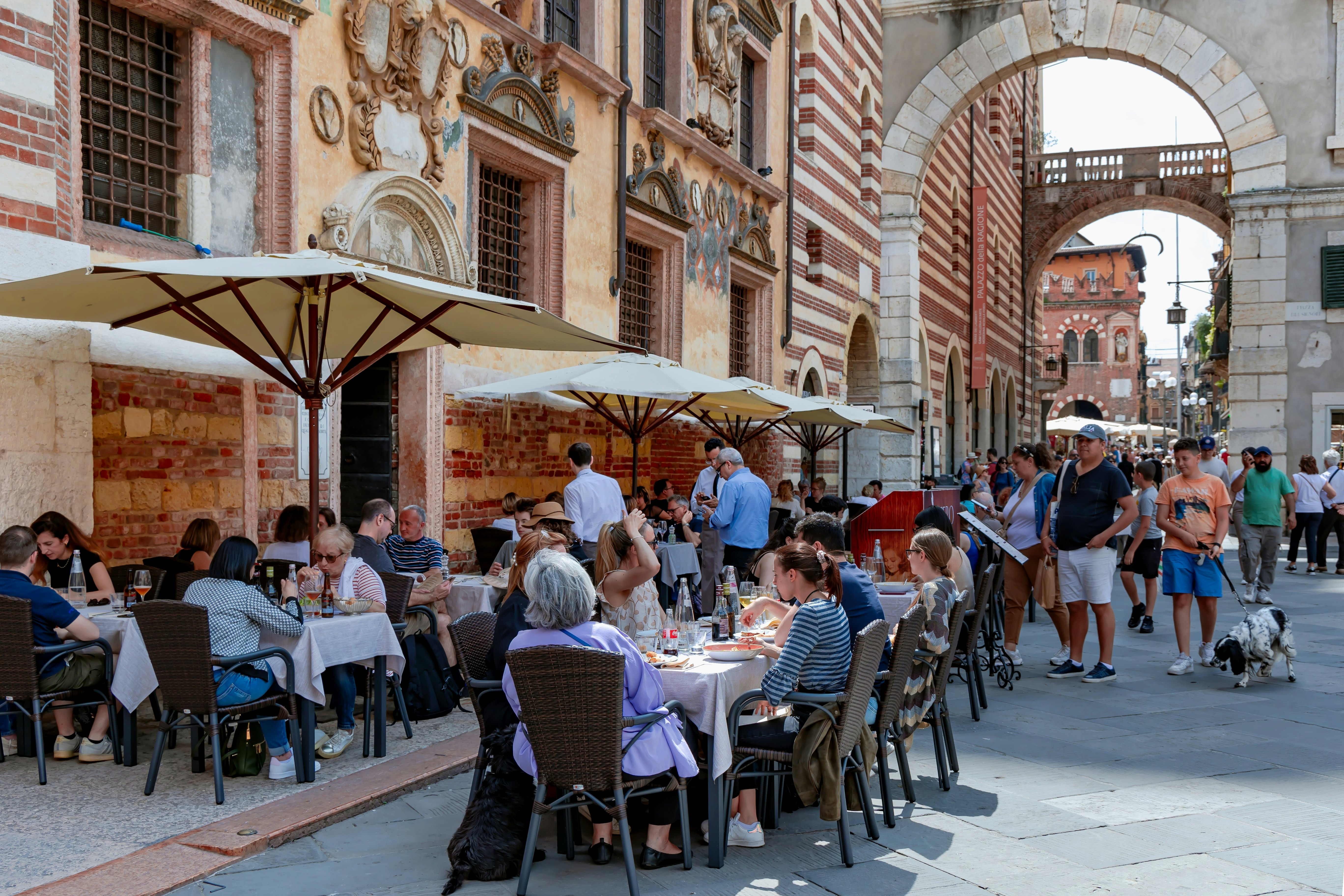 People eating outdoors on a plaza