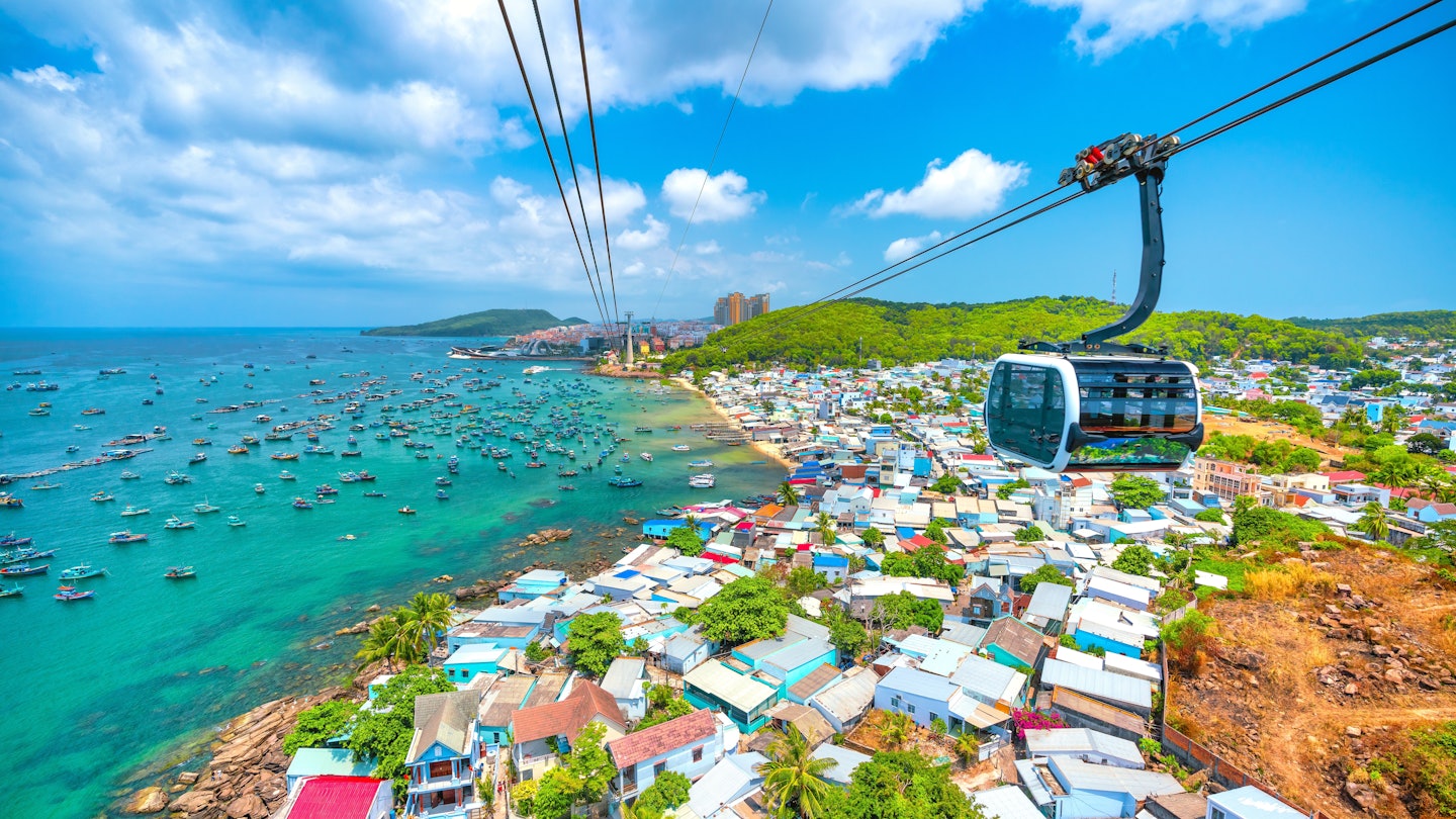 View of longest cable car ride in the world, Phu Quoc island, Vietnam. Below is seascape with tropical islands and boats., License Type: media, Download Time: 2025-03-21T00:20:20.000Z, User: claramonitto, Editorial: false, purchase_order: 56530 - Guidebooks, job: Global Publishing-WIP, client: Vietnam 17, other: Clara Monitto