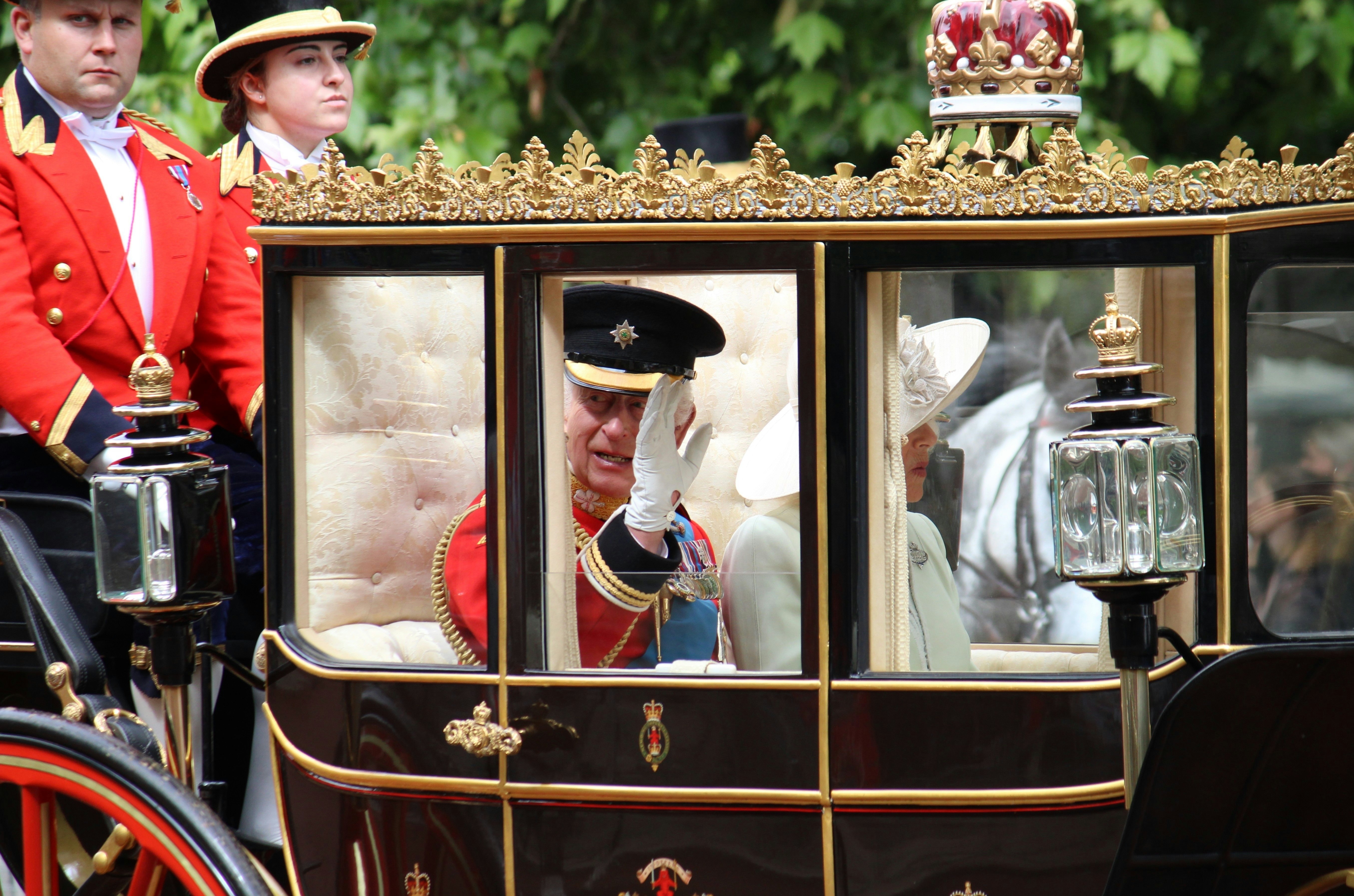 King Charles and Queen Camilla in a carriage during the Trooping the Color parade, London, England.
