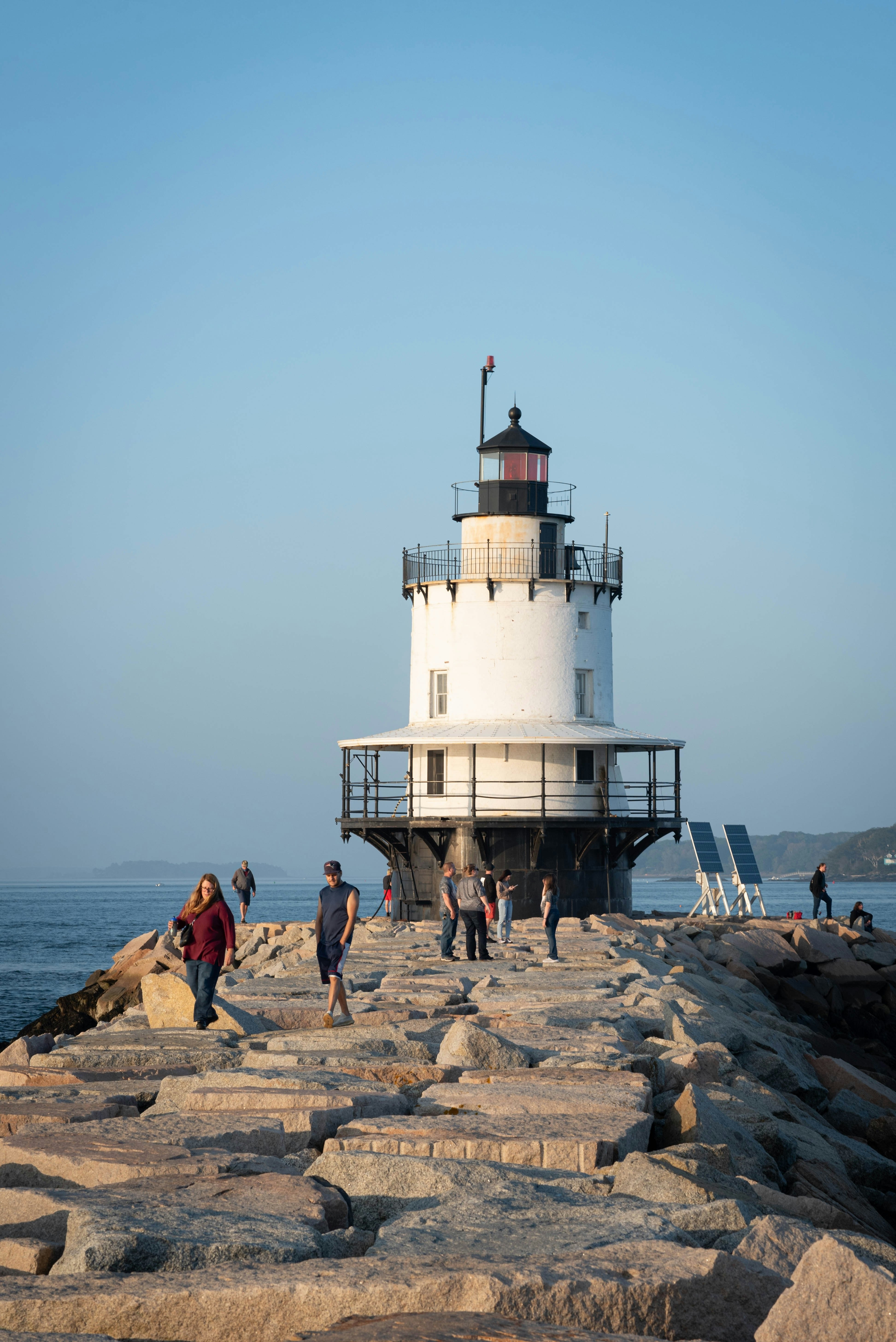 The historic Spring Point Ledge Lighthouse at the end of an impressive, 900-foot granite breakwater ledge in South Portland, Maine.