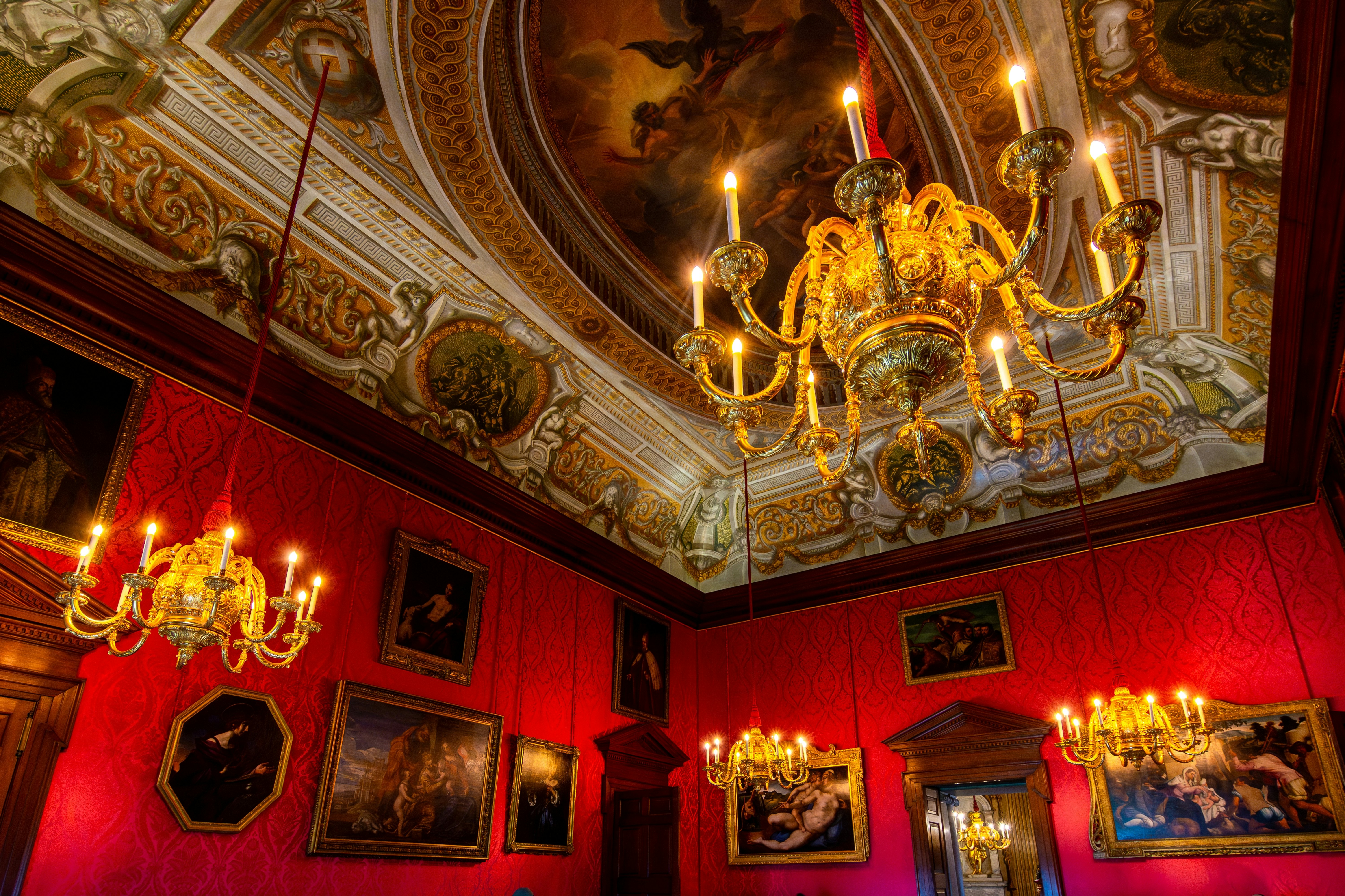 Sumptuous interiors at Kensington Palace, London, Englland, with chandeliers and paintings.