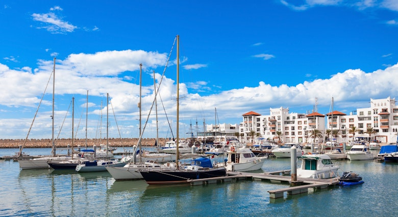 Boats at the Marina harbour in Agadir. Agadir is a major city in Morocco located on the shore of the Atlantic Ocean, near the Atlas Mountains., License Type: media, Download Time: 2025-07-03T15:21:06.000Z, User: fabricencoredesign31, Editorial: false, purchase_order: 56530 - Guidebooks, job: Global Publishing-WIP, client: North Africa 2, other: Fabrice Robin